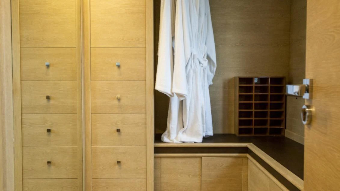 a room with a dresser and a curtain aboard GRACE Yacht for Sale