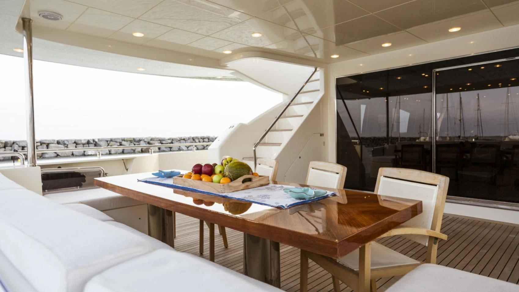 a room with a table and chairs aboard GRACE Yacht for Sale