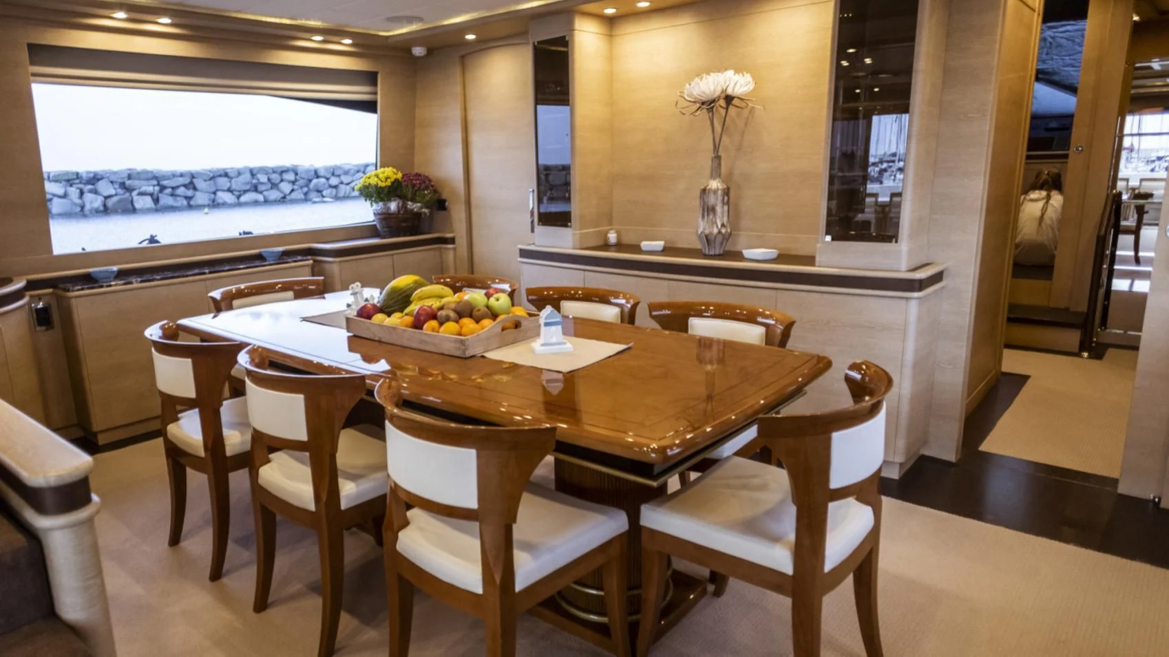 a table with chairs around it aboard GRACE Yacht for Sale