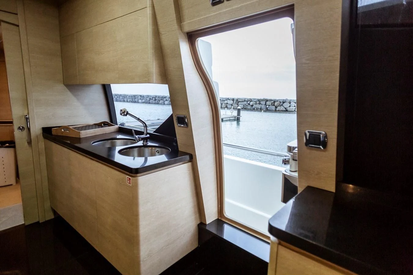 a kitchen with a sink and a window aboard GRACE Yacht for Sale