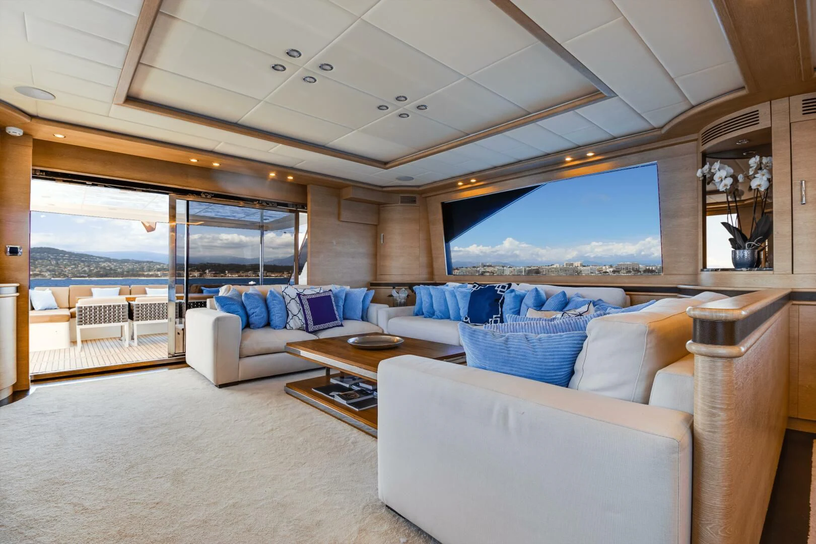 a living room with a large screen aboard GRACE Yacht for Sale