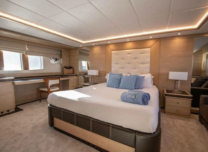 a large bedroom with a large bed aboard GRACE Yacht for Sale