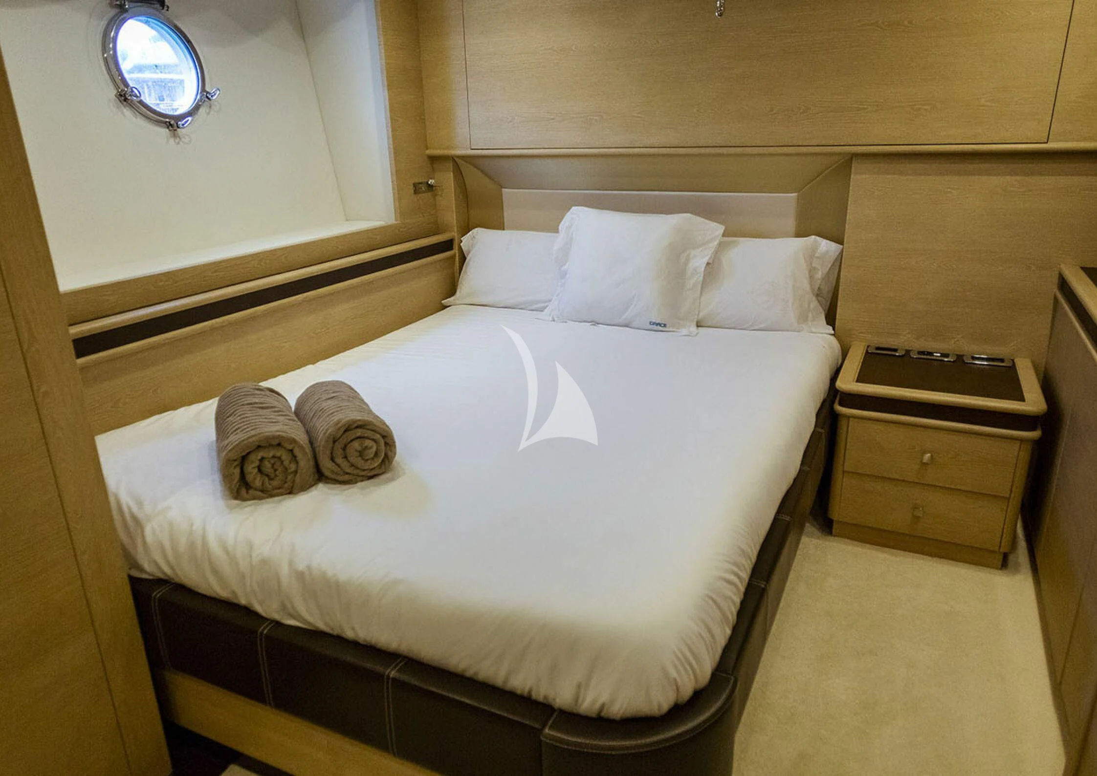 a bed with white sheets aboard GRACE Yacht for Sale