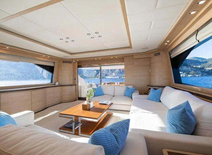 a room with a couch and a table aboard GRACE Yacht for Sale