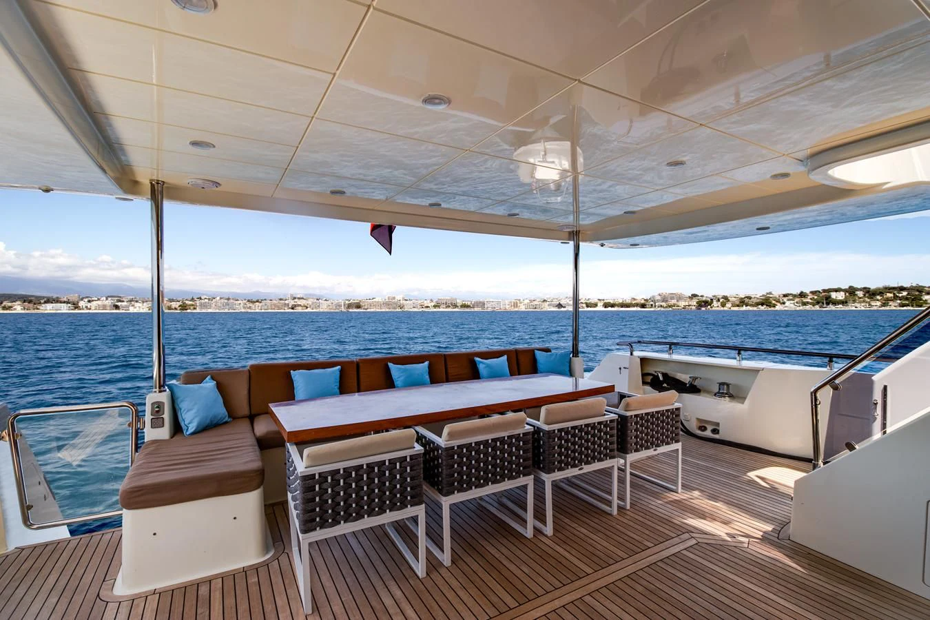 a deck with chairs and a table on it aboard GRACE Yacht for Sale
