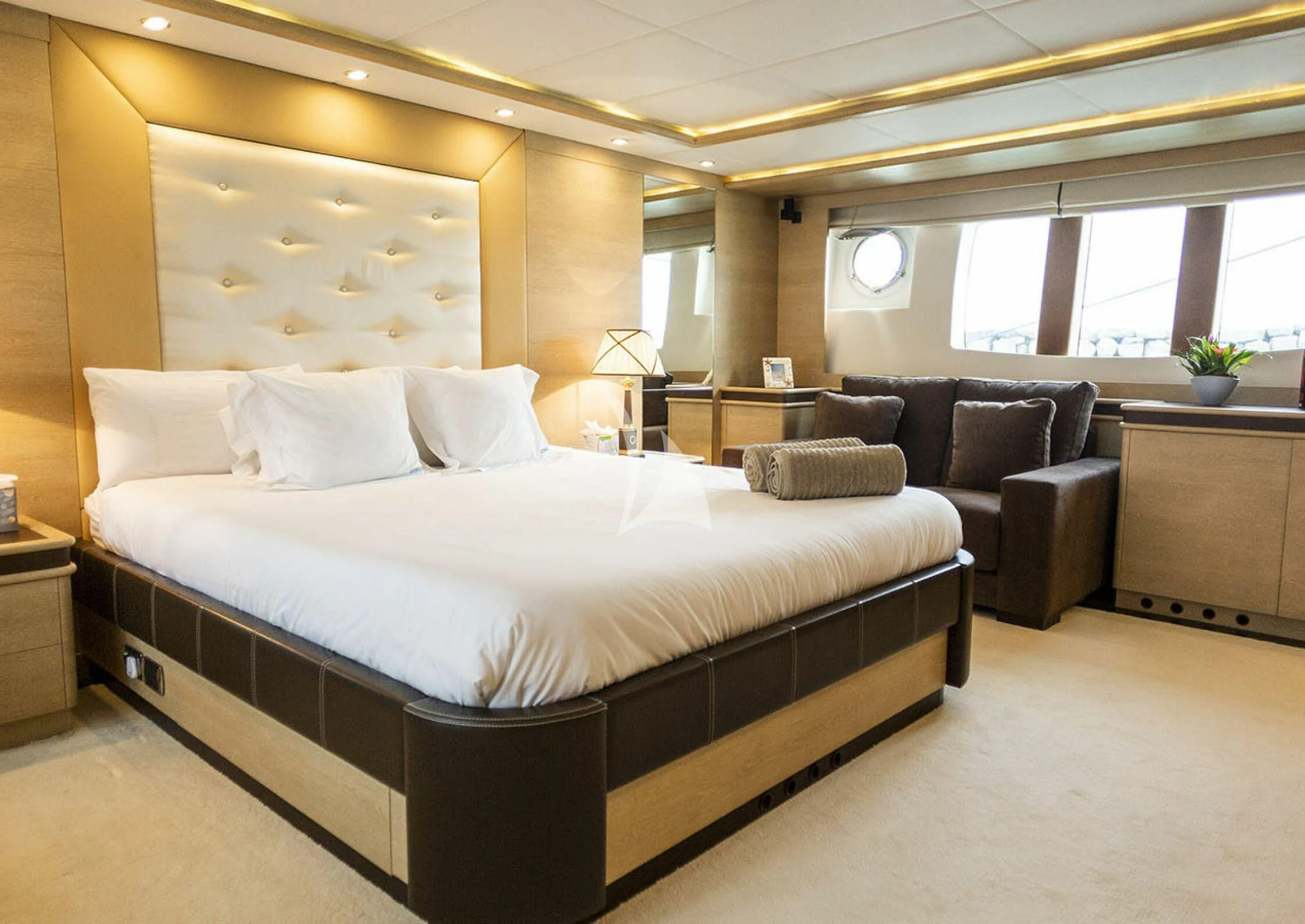 a large bed in a room aboard GRACE Yacht for Sale