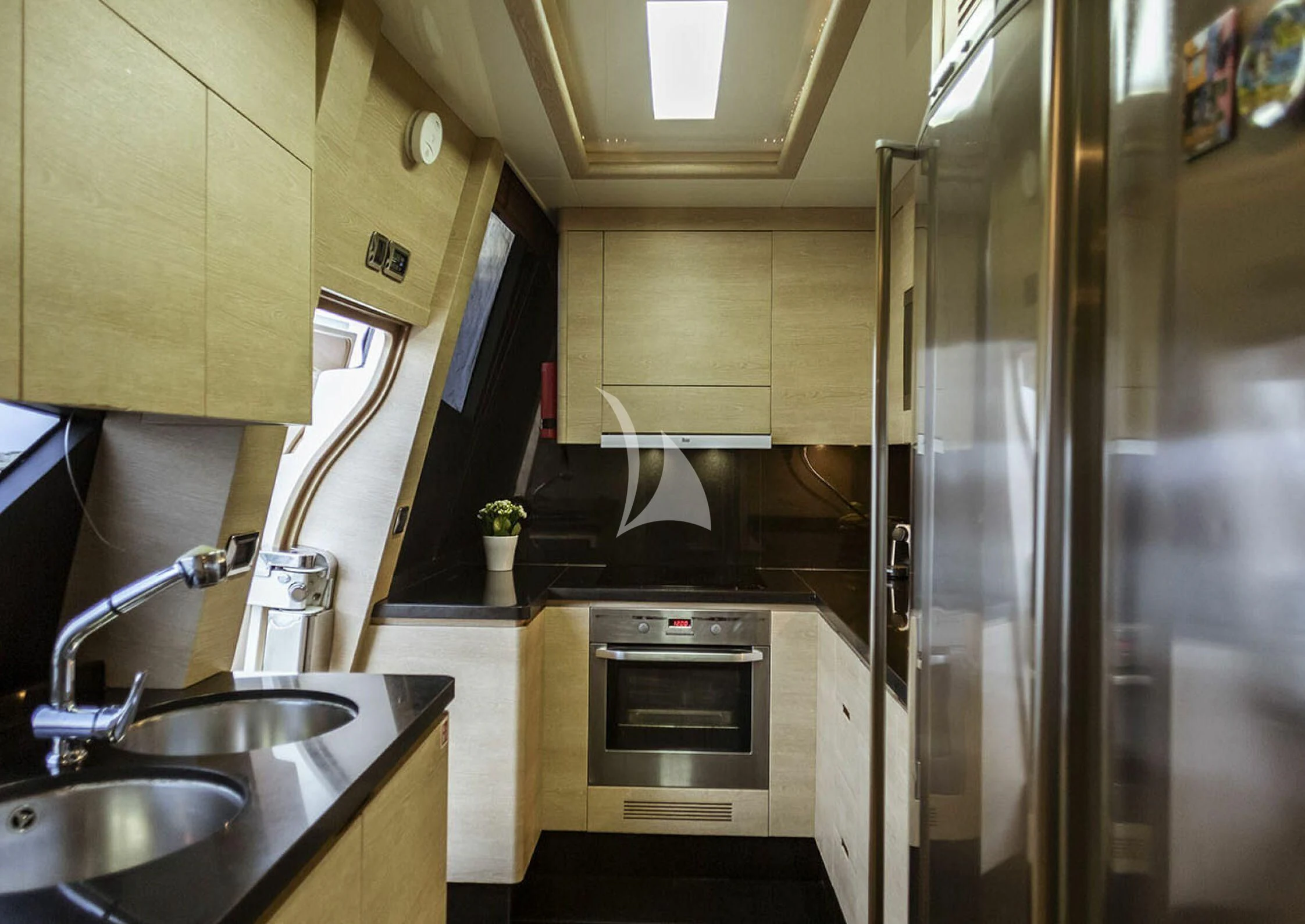 a kitchen with stainless steel appliances aboard GRACE Yacht for Sale