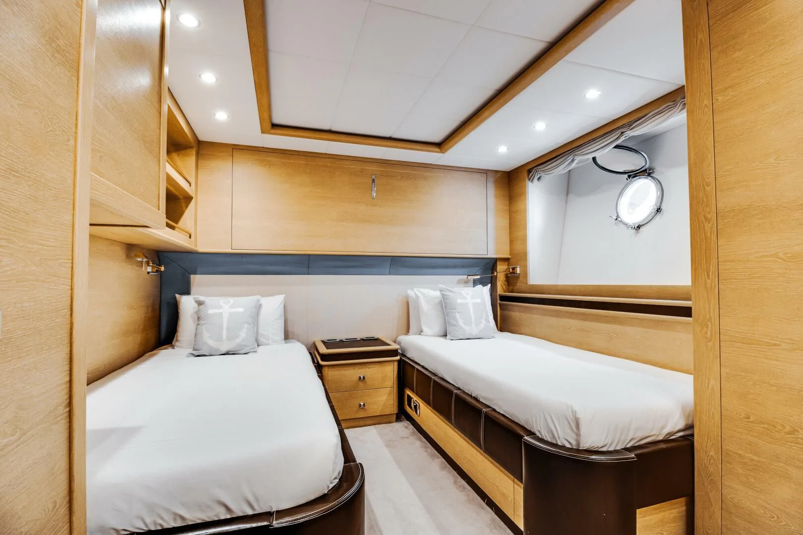a room with two beds aboard GRACE Yacht for Sale