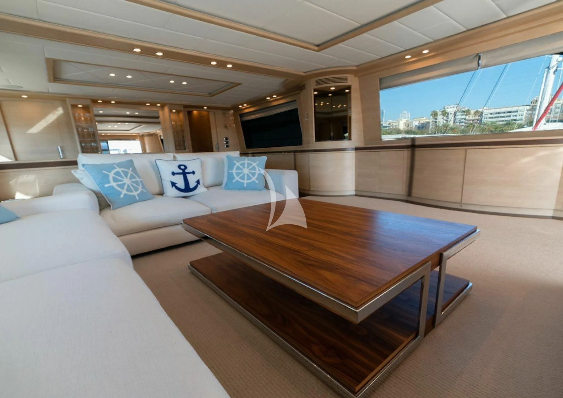 a room with a table and couches aboard GRACE Yacht for Sale