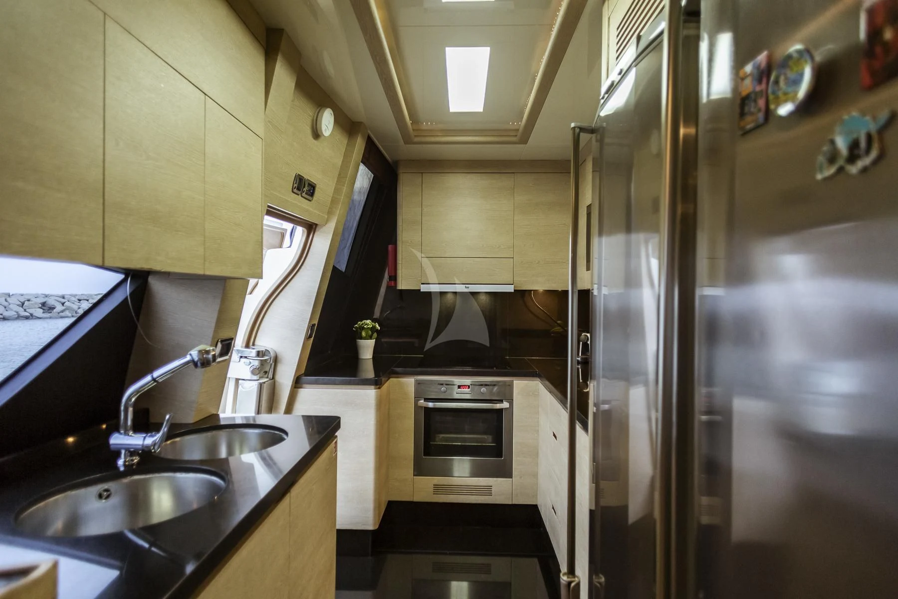 a kitchen with stainless steel appliances aboard GRACE Yacht for Sale