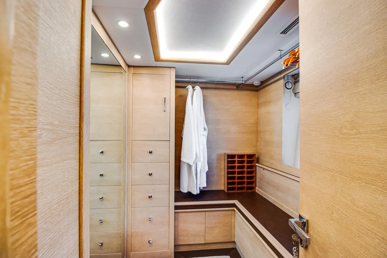 a bathroom with wooden cabinets aboard GRACE Yacht for Sale