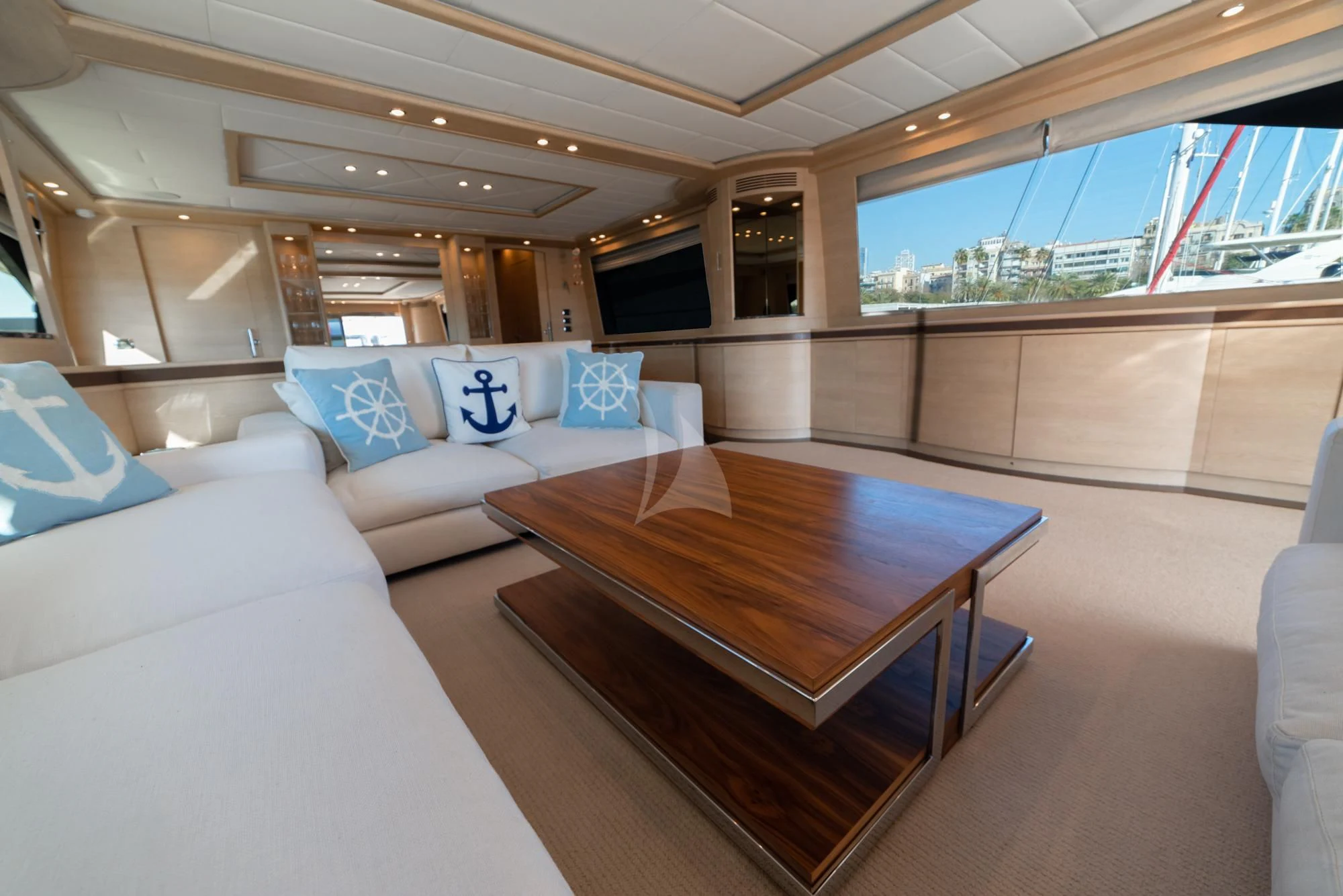 a room with a table and couches aboard GRACE Yacht for Sale
