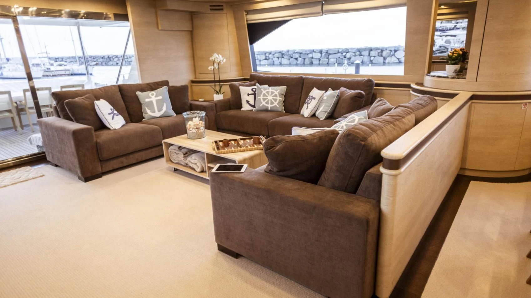 a living room with leather couches aboard GRACE Yacht for Sale