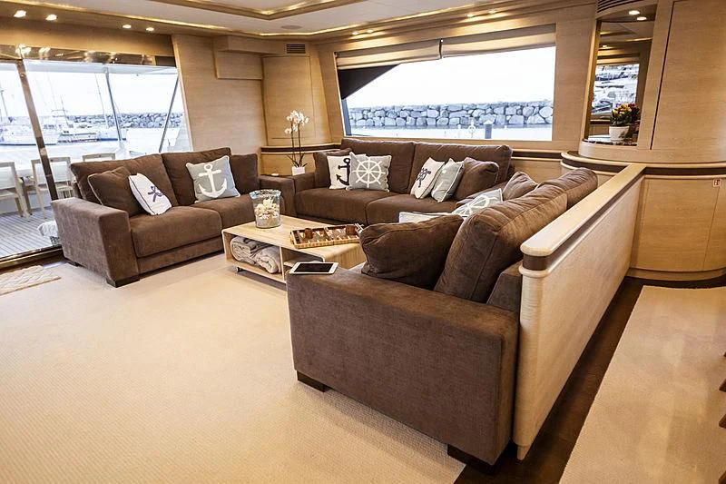 a living room with leather couches aboard GRACE Yacht for Sale
