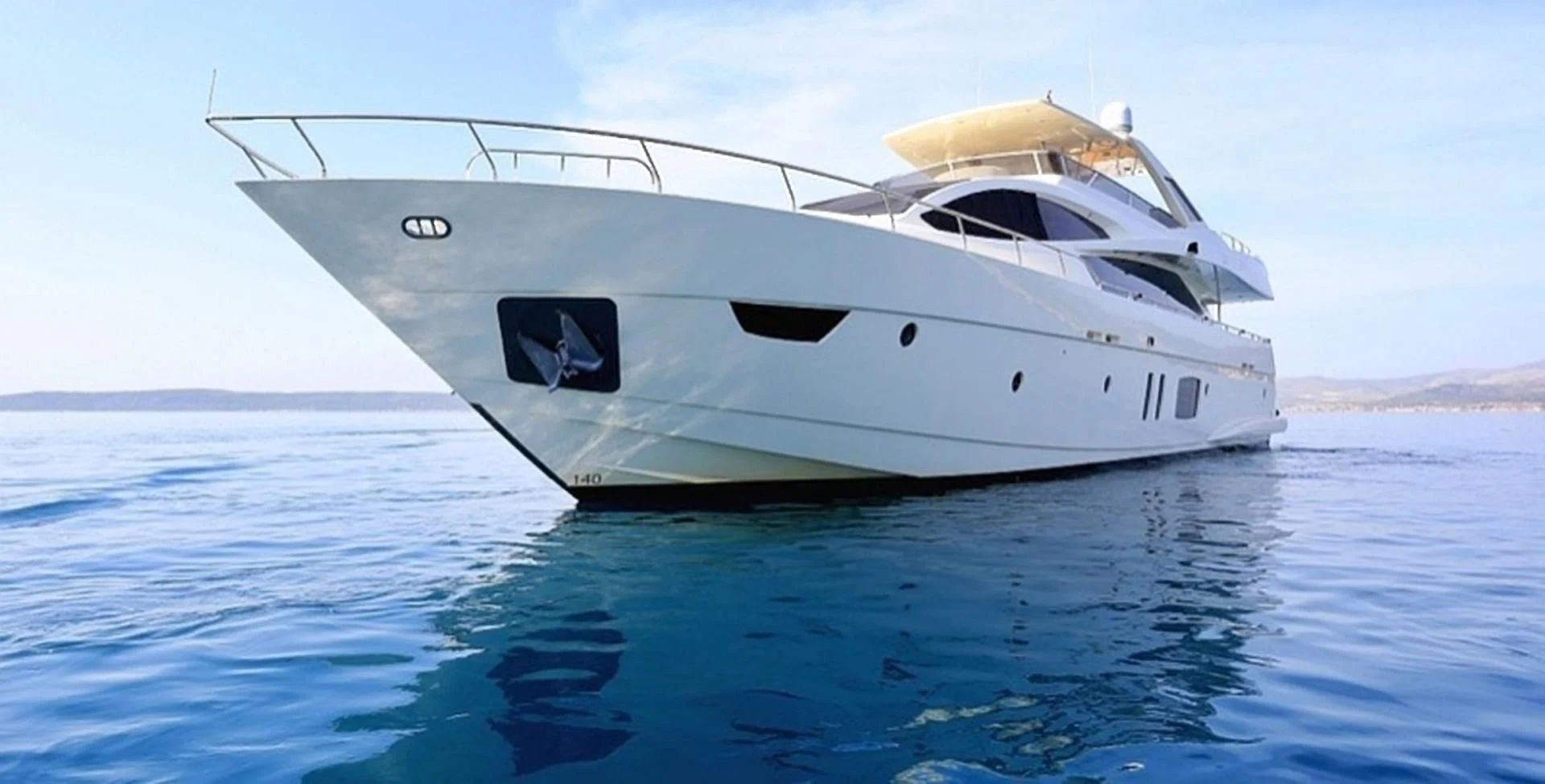 a white yacht in the water aboard GRACE Yacht for Sale