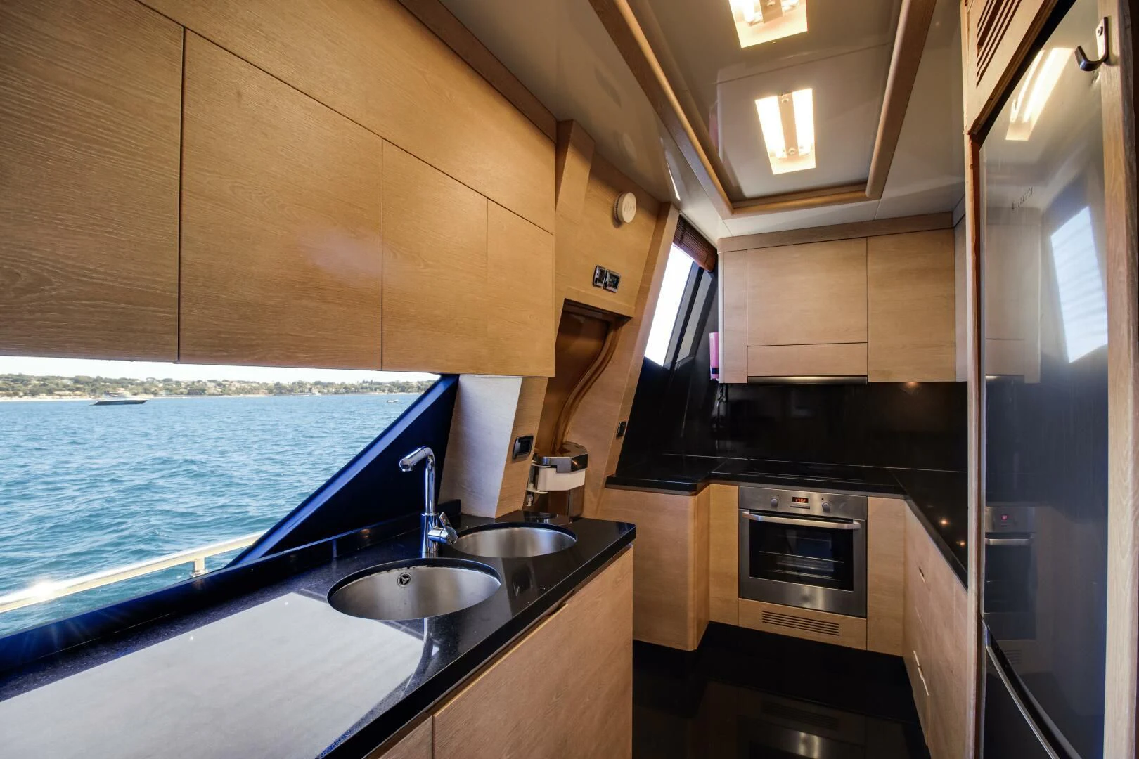 a kitchen with a sink and a stove aboard GRACE Yacht for Sale