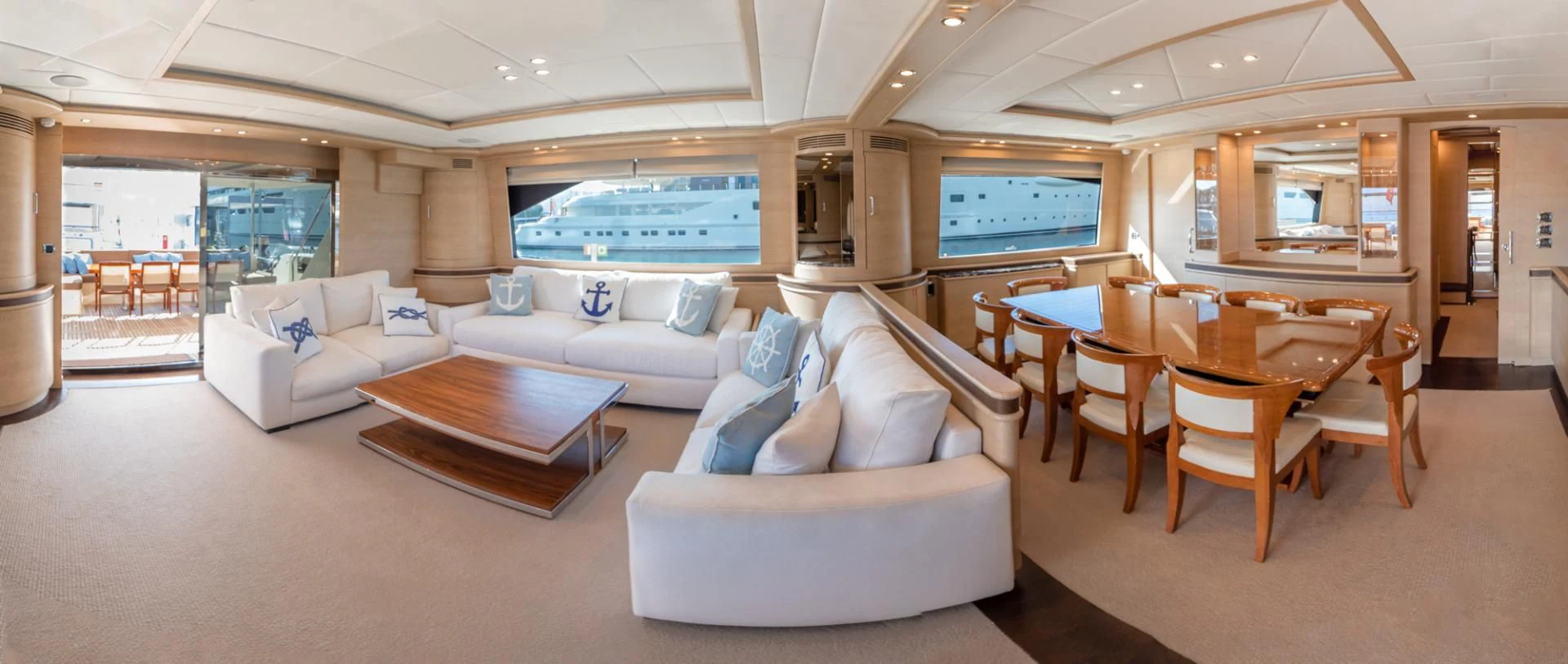 a living room with a couch and a table aboard GRACE Yacht for Sale