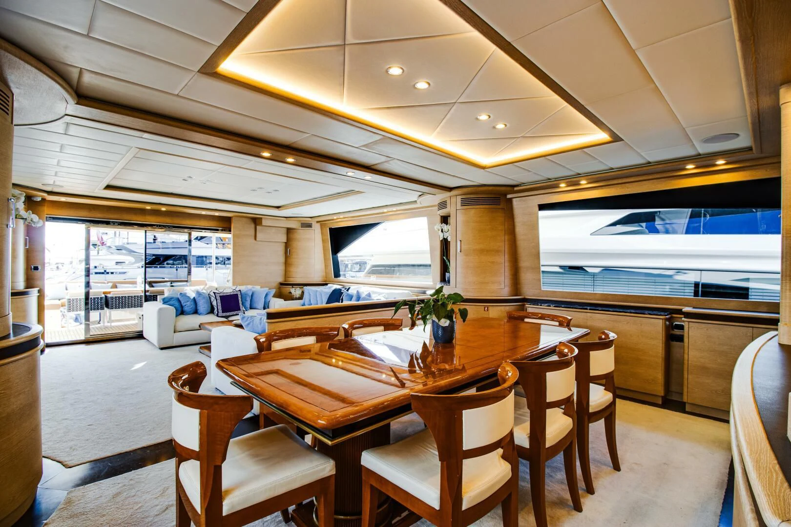 a large dining table in a room aboard GRACE Yacht for Sale