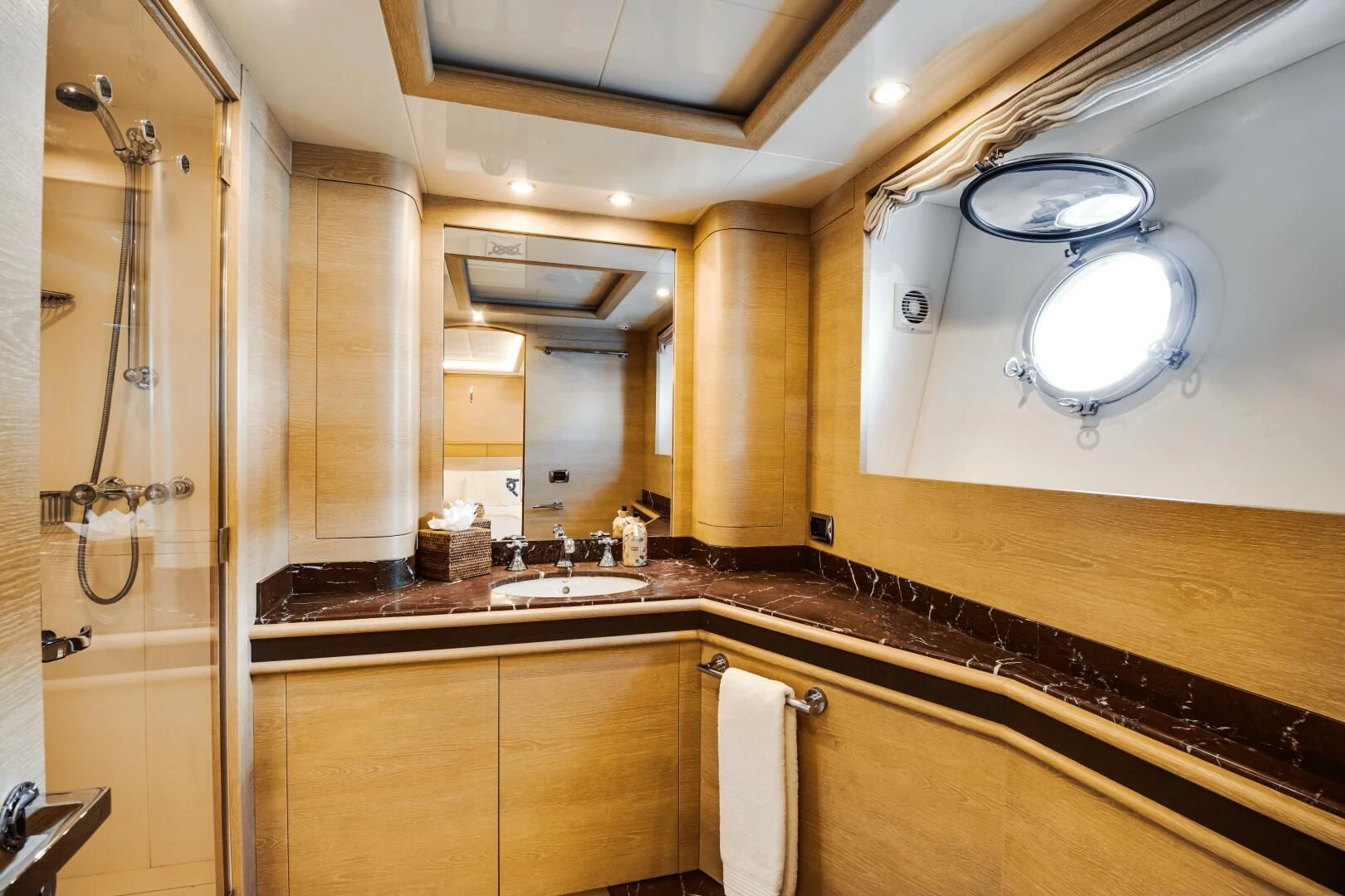 a bathroom with a sink and a mirror aboard GRACE Yacht for Sale