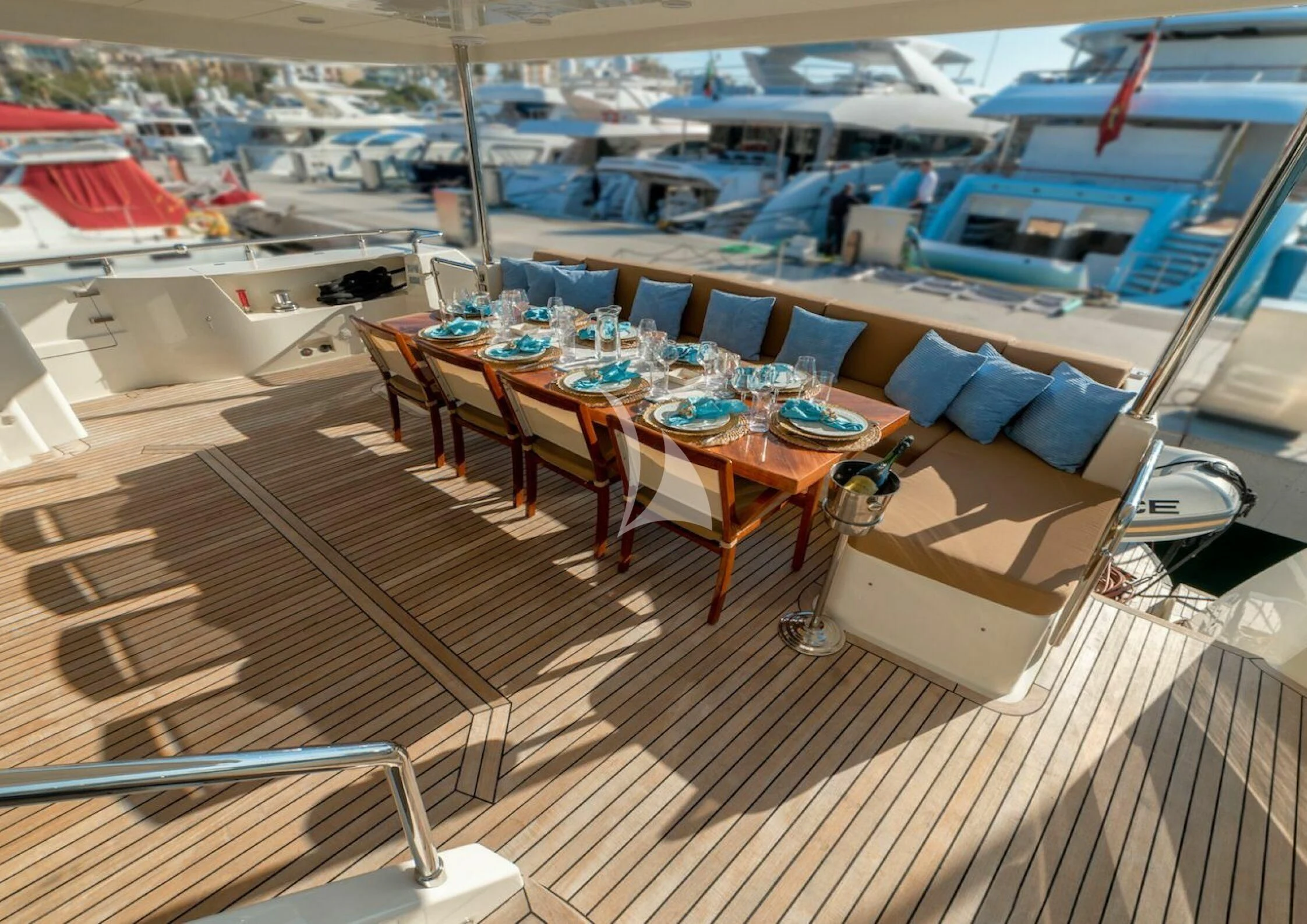 a deck with a table and chairs aboard GRACE Yacht for Sale
