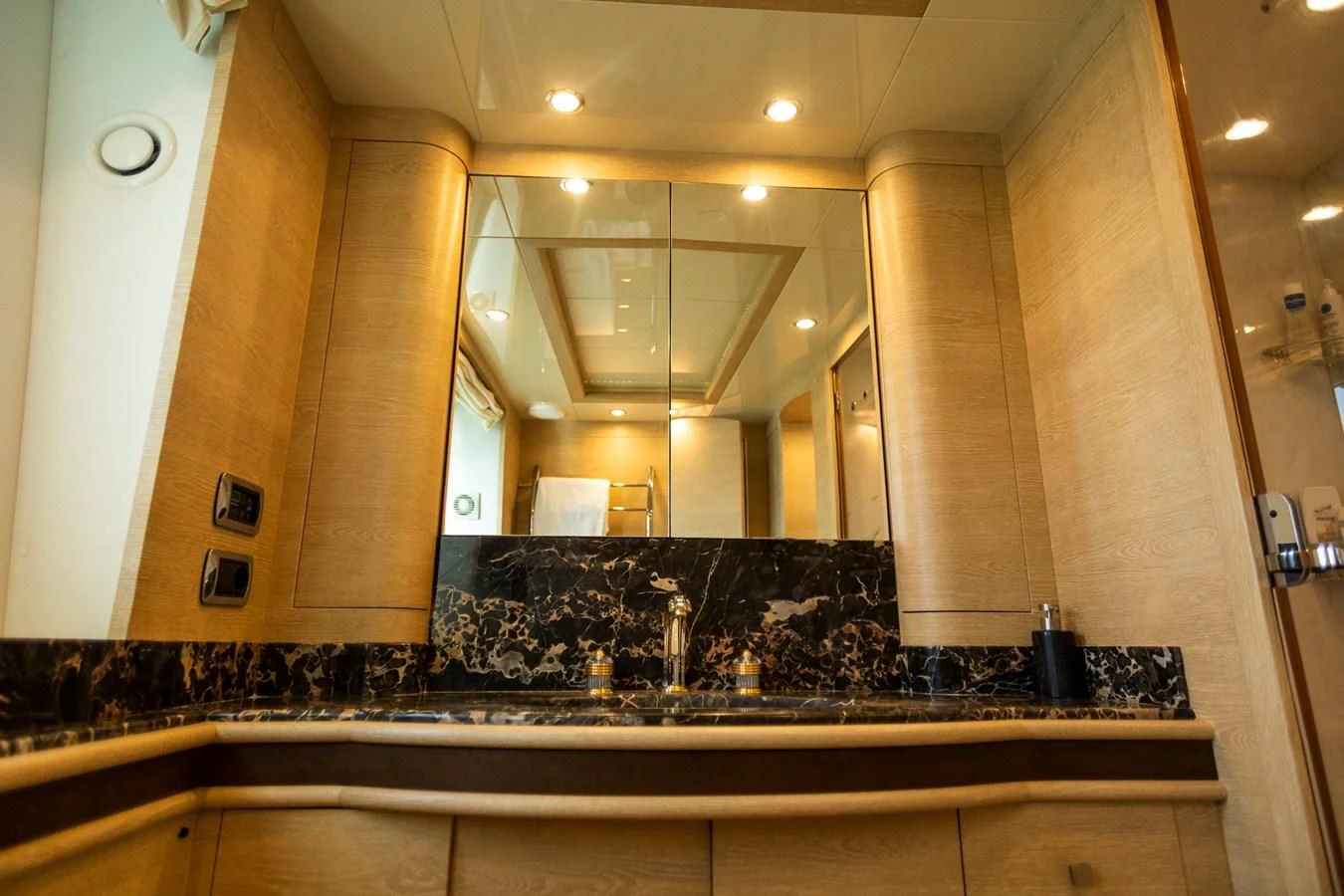 a large bathroom with a marble counter top aboard GRACE Yacht for Sale