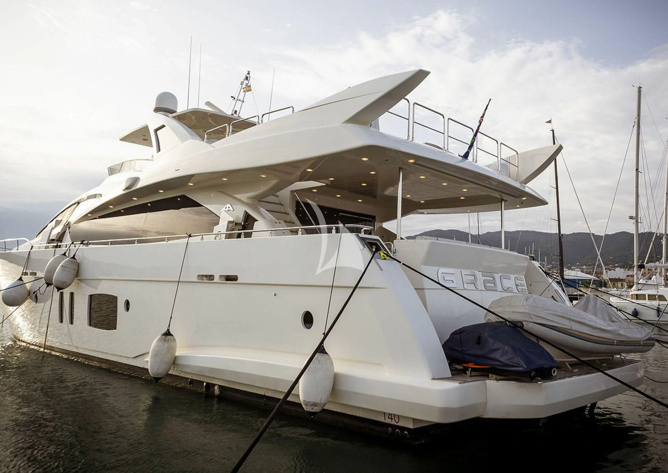 a white boat on the water aboard GRACE Yacht for Sale