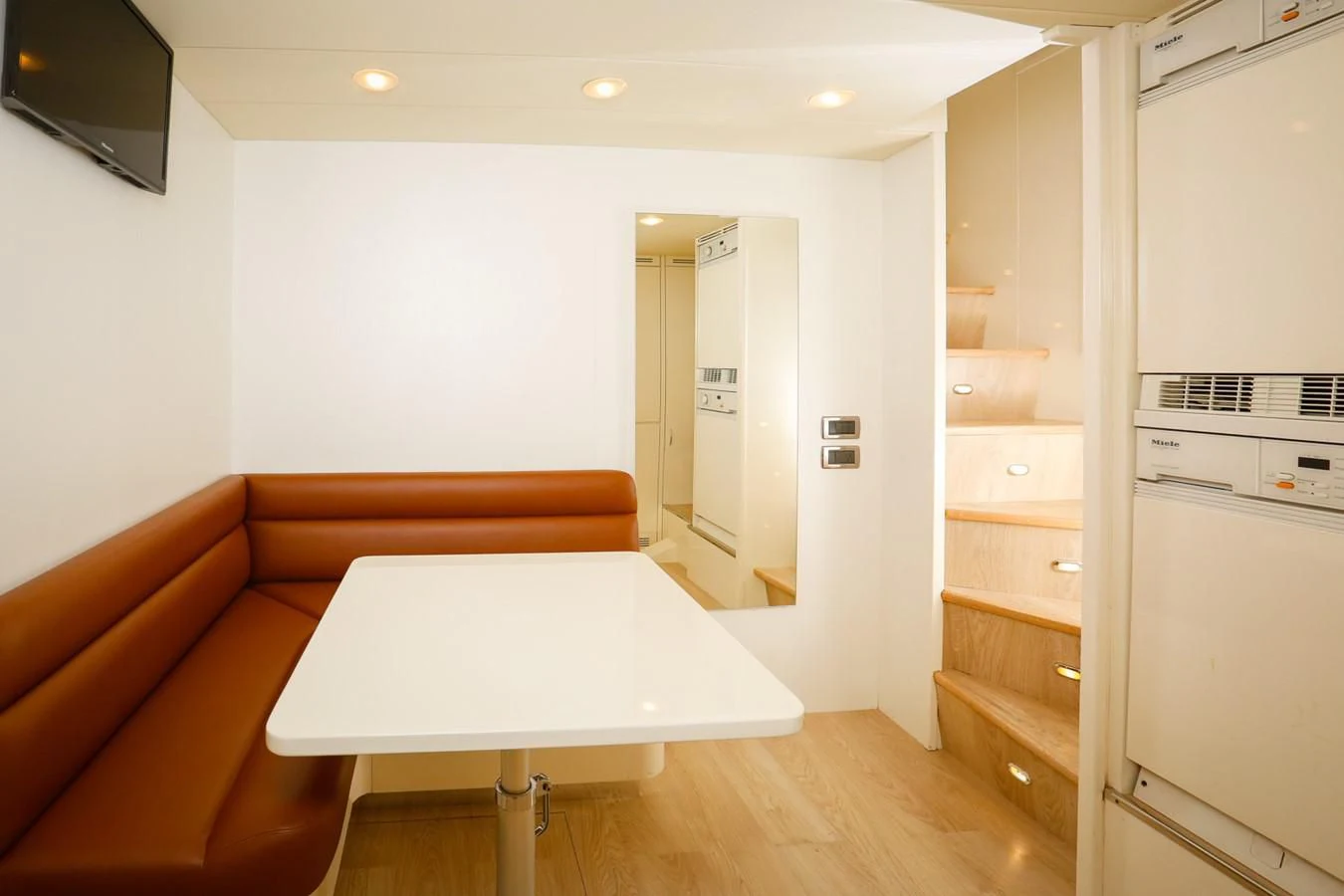 a living room with a couch and a table aboard HUNTER Yacht for Sale