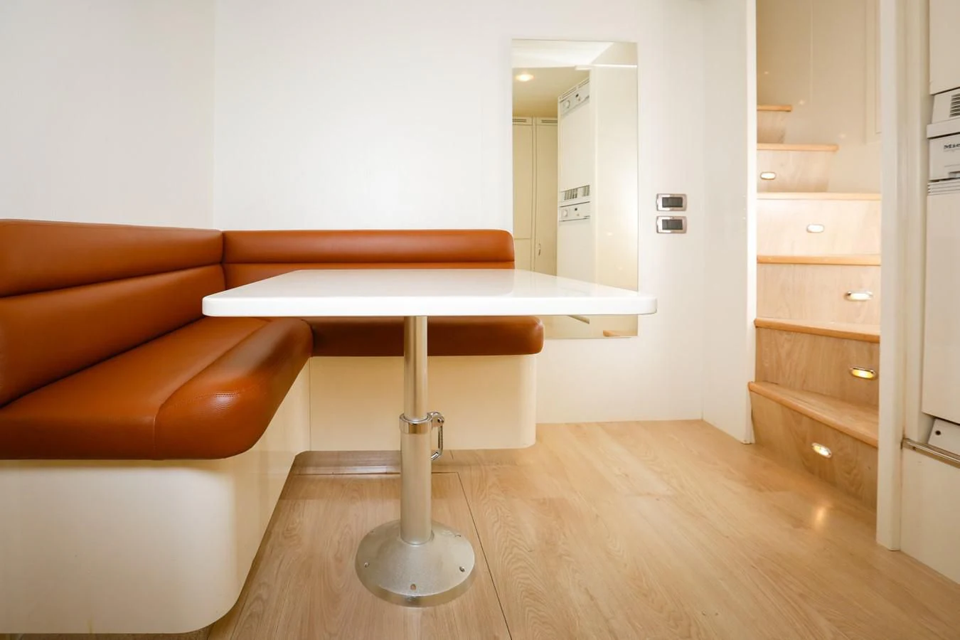 a kitchen with a table and a couch aboard HUNTER Yacht for Sale
