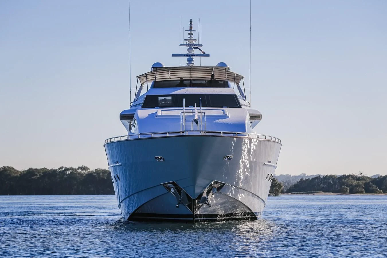a large blue boat in the water aboard HUNTER Yacht for Sale