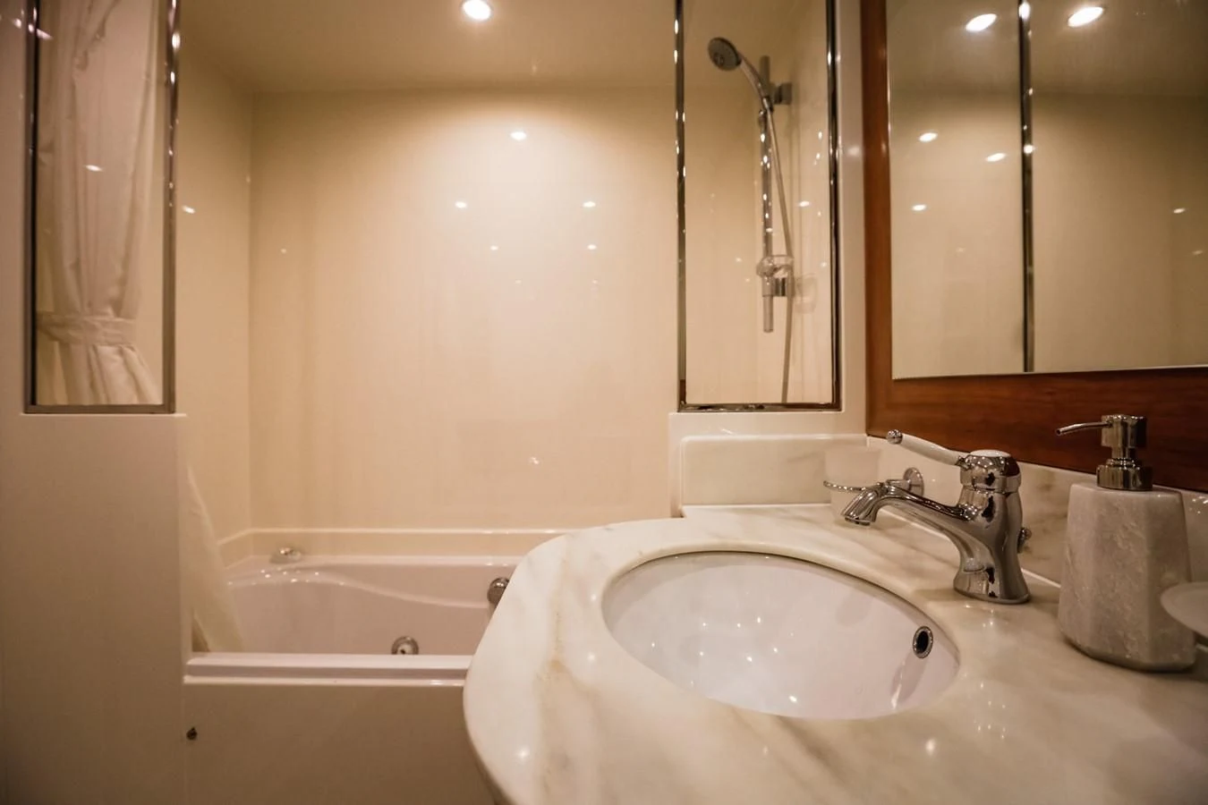 a bathroom with a sink and bathtub aboard HUNTER Yacht for Sale
