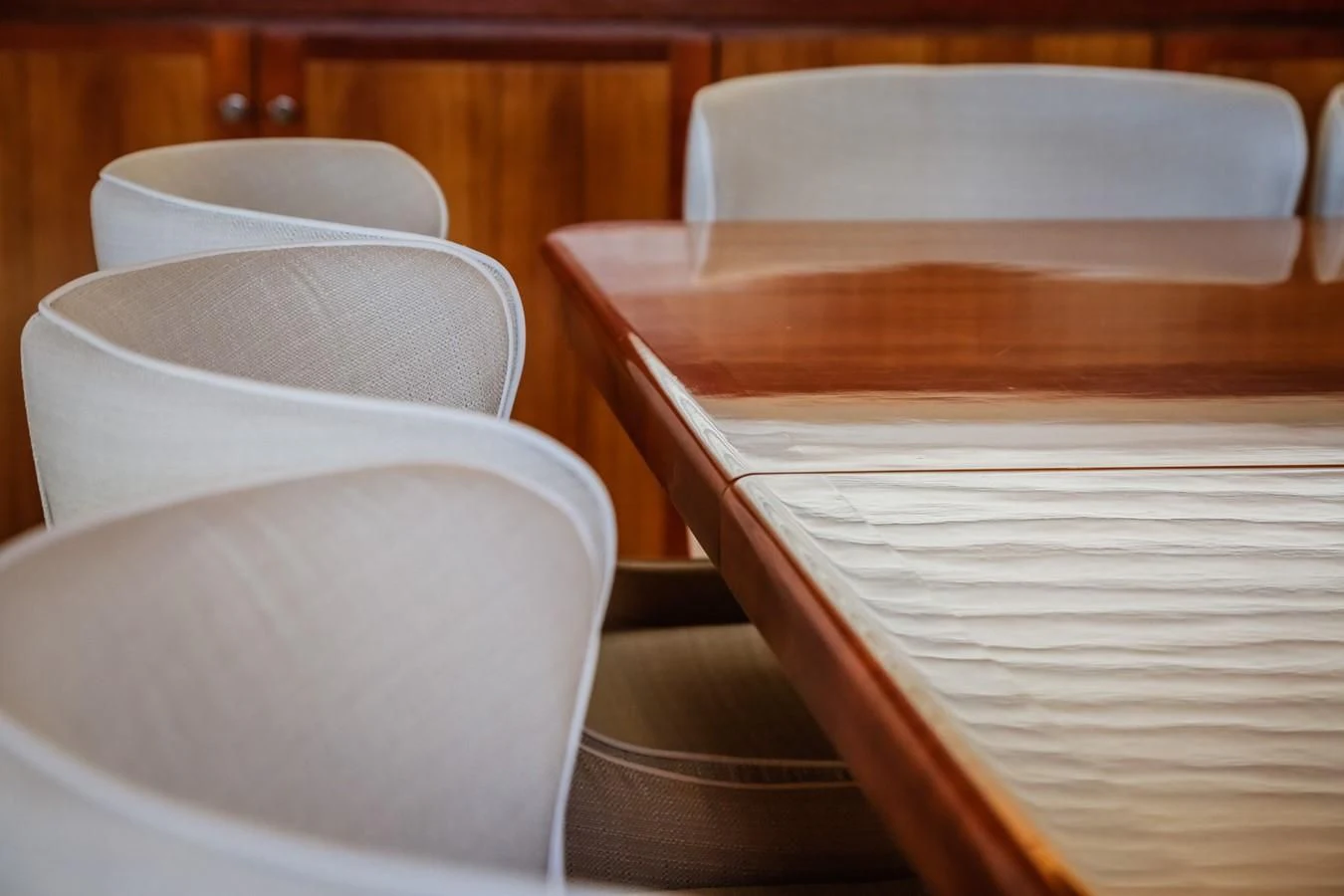 a pair of white chairs aboard HUNTER Yacht for Sale