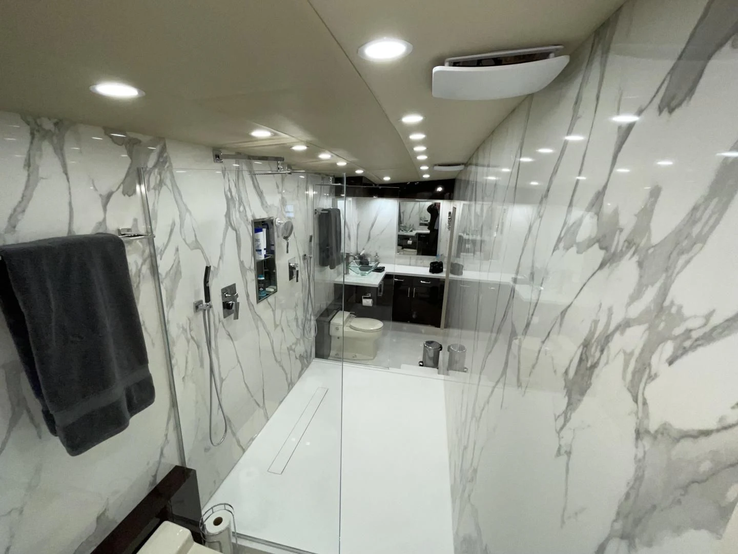 a bathroom with a sink and a shower aboard SOVEREIGN LADY Yacht for Sale