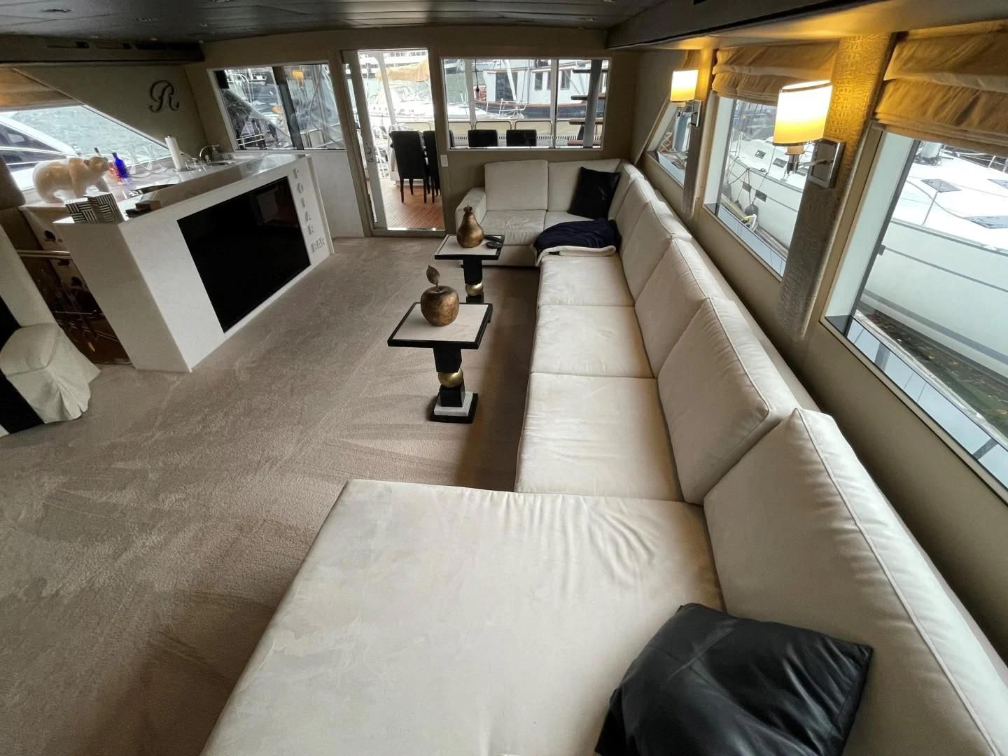 a living room with a couch and a coffee table aboard SOVEREIGN LADY Yacht for Sale
