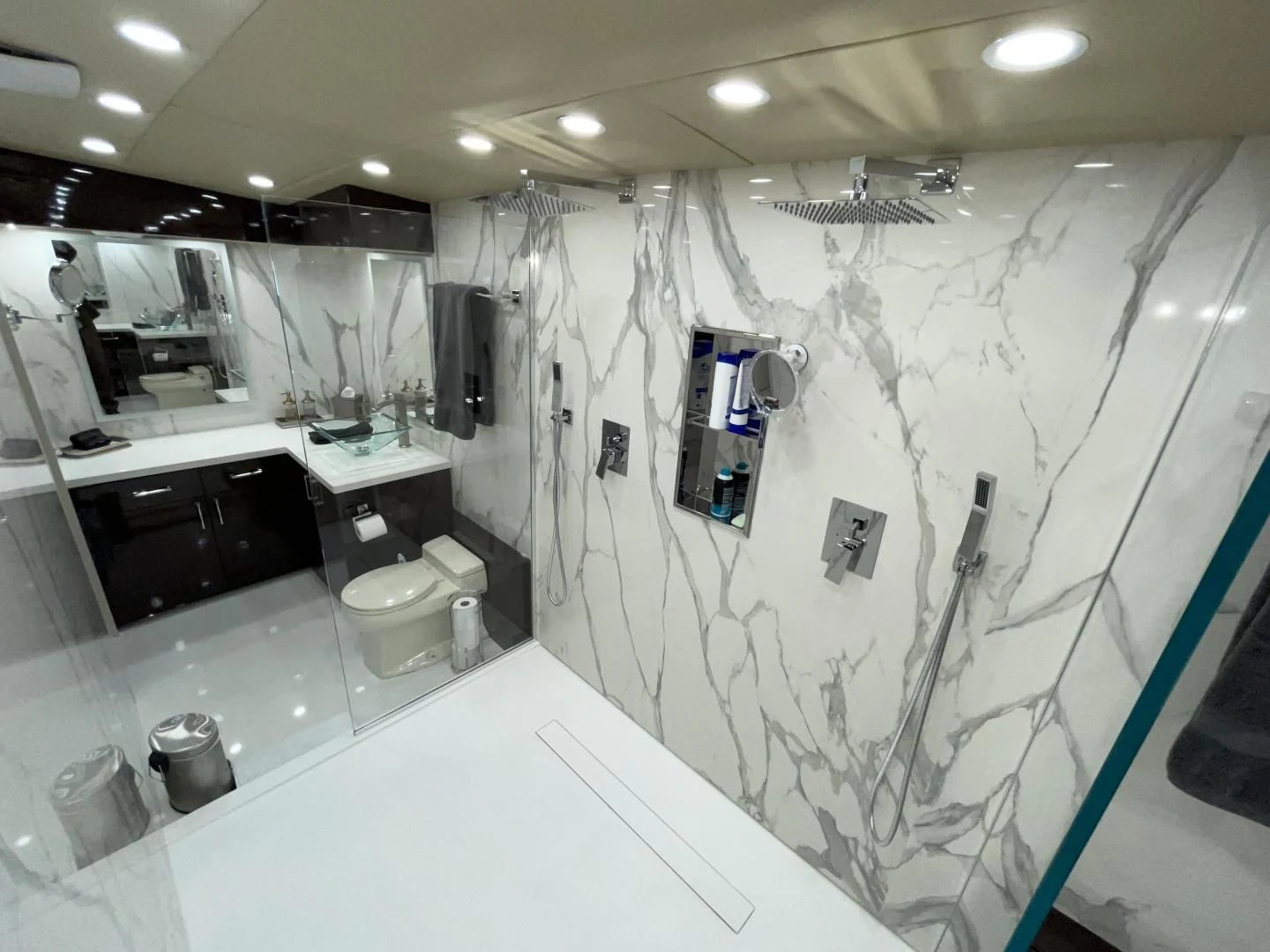 a bathroom with a large mirror aboard SOVEREIGN LADY Yacht for Sale
