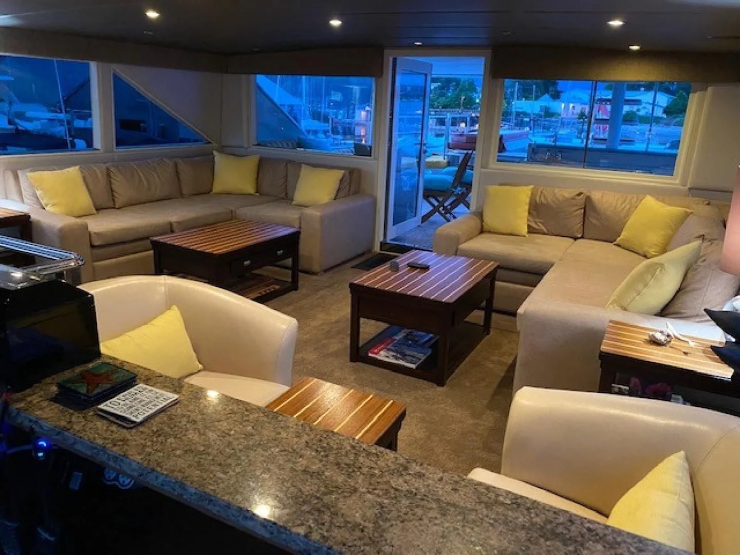 a living room with a couch and a coffee table aboard SOVEREIGN LADY Yacht for Sale