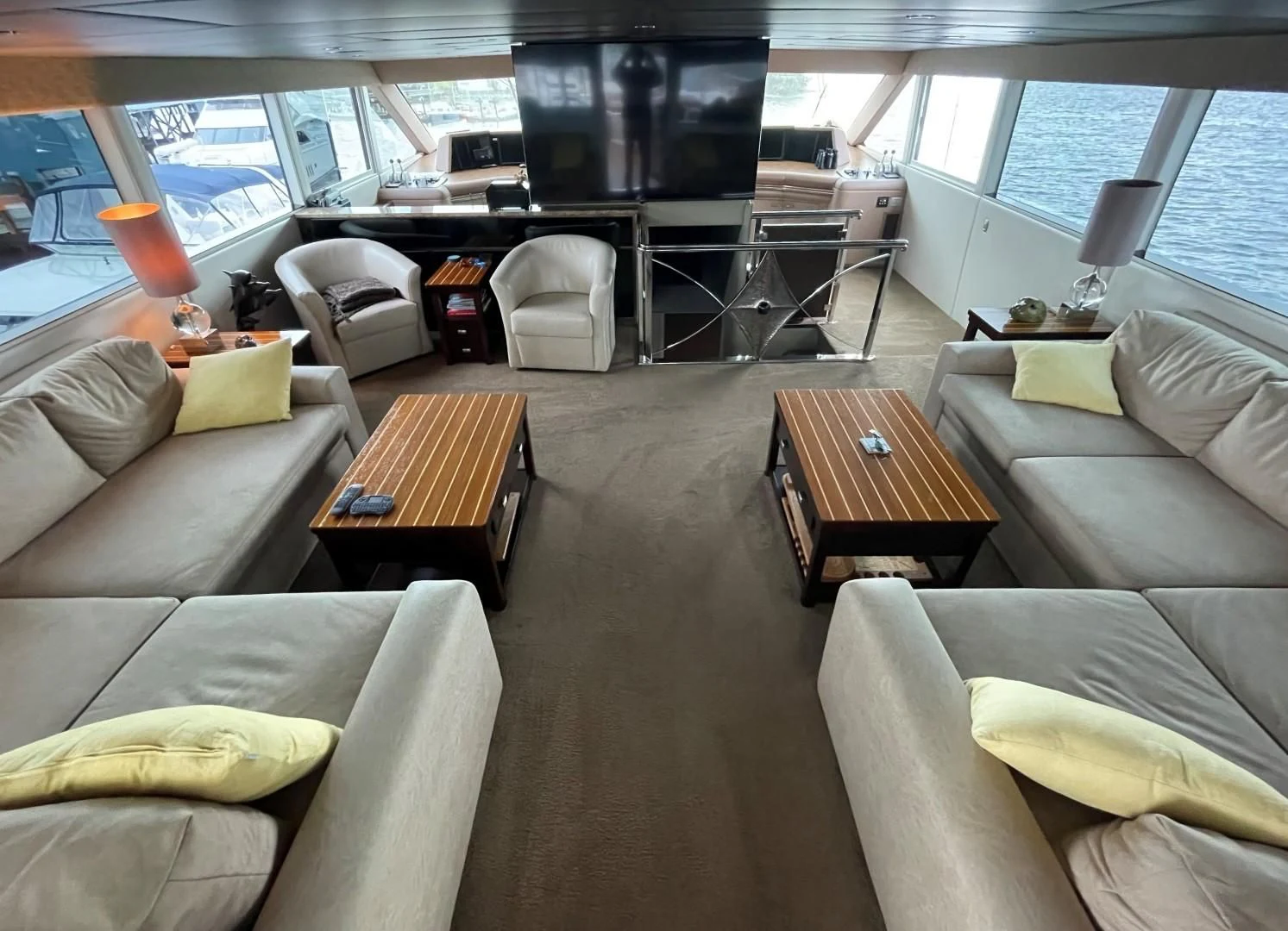 a living room with a large window aboard SOVEREIGN LADY Yacht for Sale