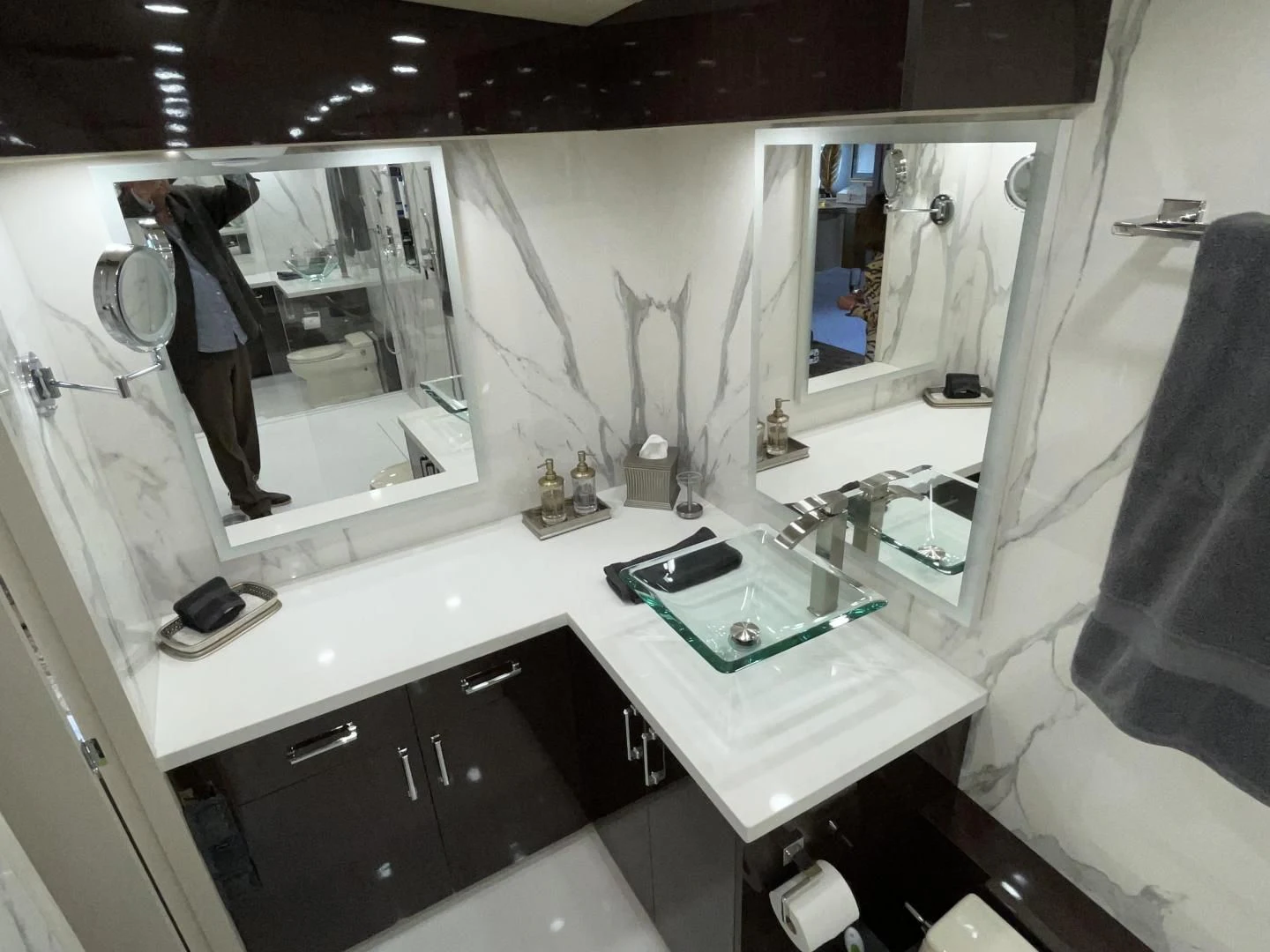a bathroom with a sink and mirror aboard SOVEREIGN LADY Yacht for Sale