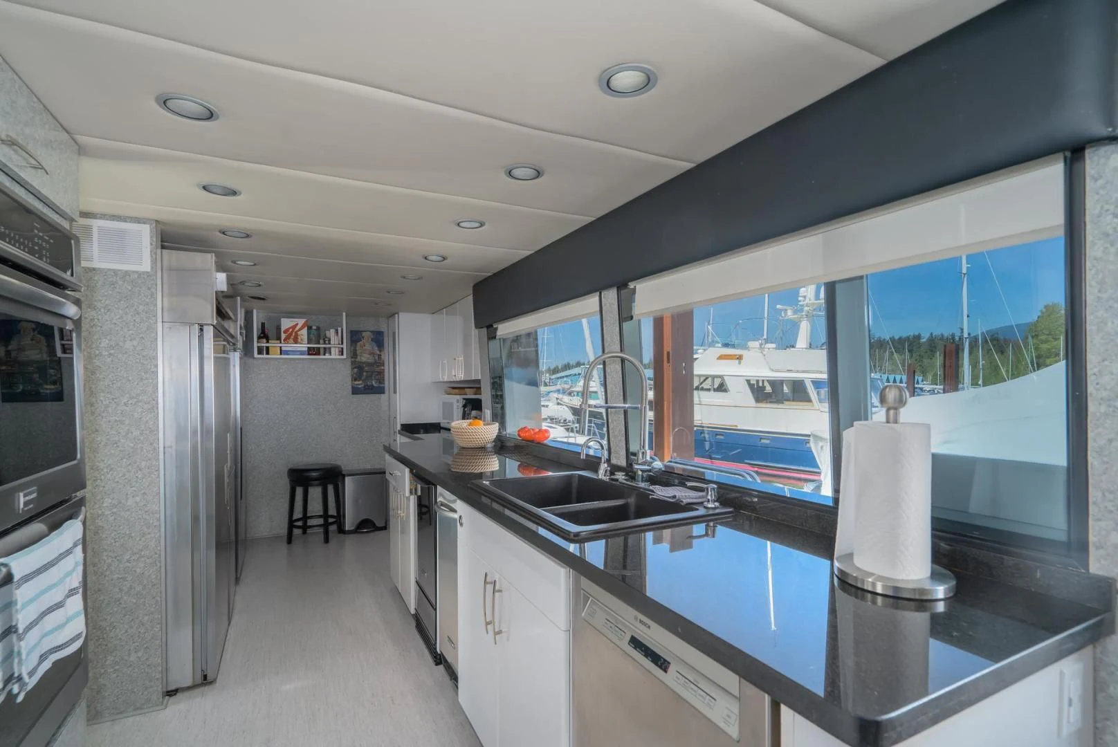 a kitchen with a large window aboard SOVEREIGN LADY Yacht for Sale