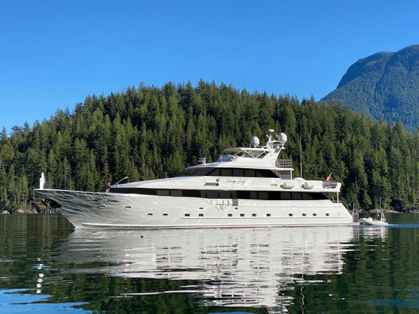 a large boat on the water aboard SOVEREIGN LADY Yacht for Sale