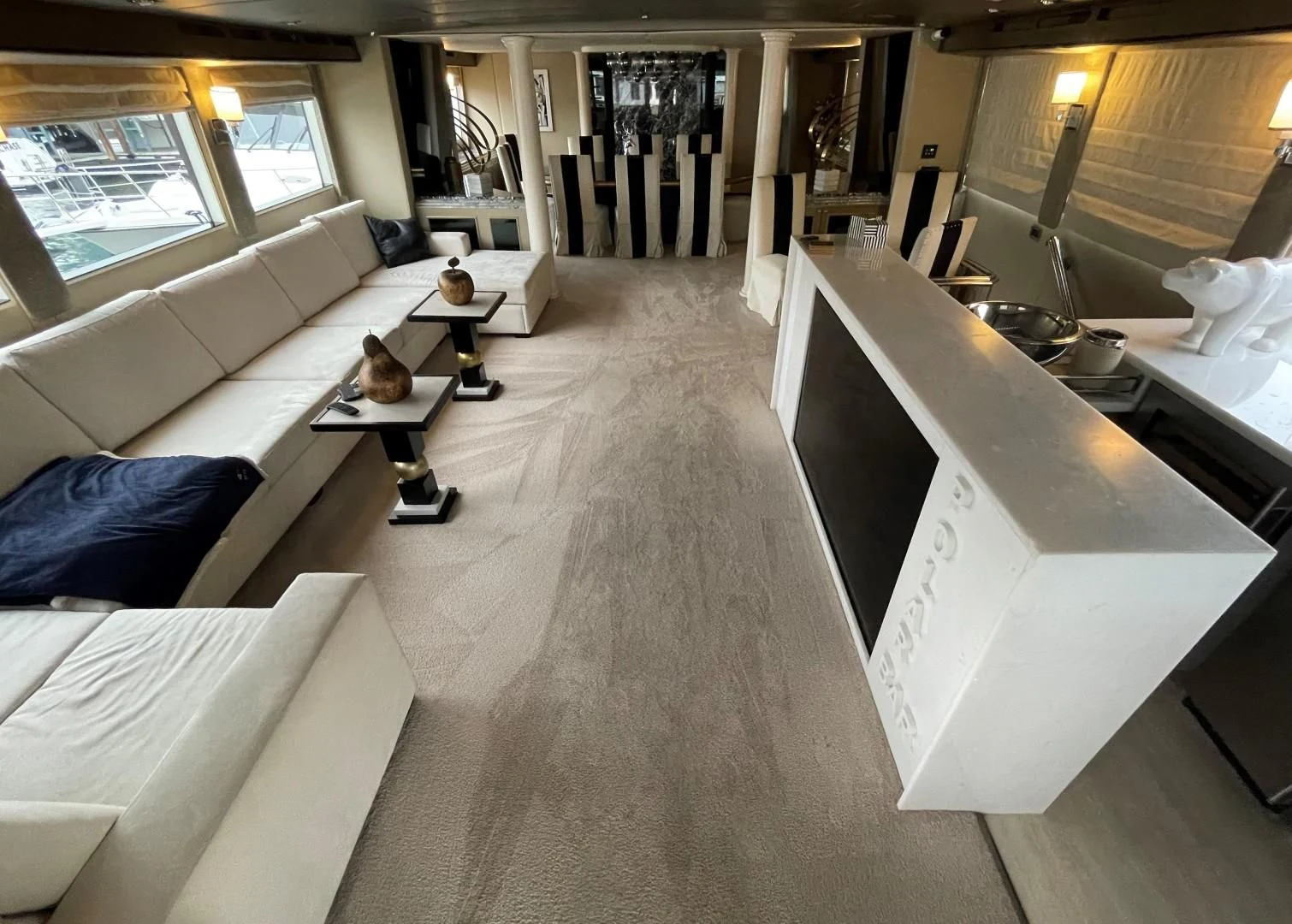 a room with a couch and a table aboard SOVEREIGN LADY Yacht for Sale