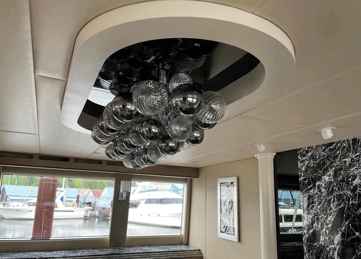 a chandelier from a ceiling aboard SOVEREIGN LADY Yacht for Sale