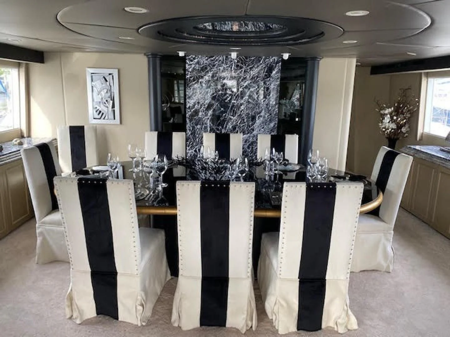 a fancy dining room with white chairs aboard SOVEREIGN LADY Yacht for Sale