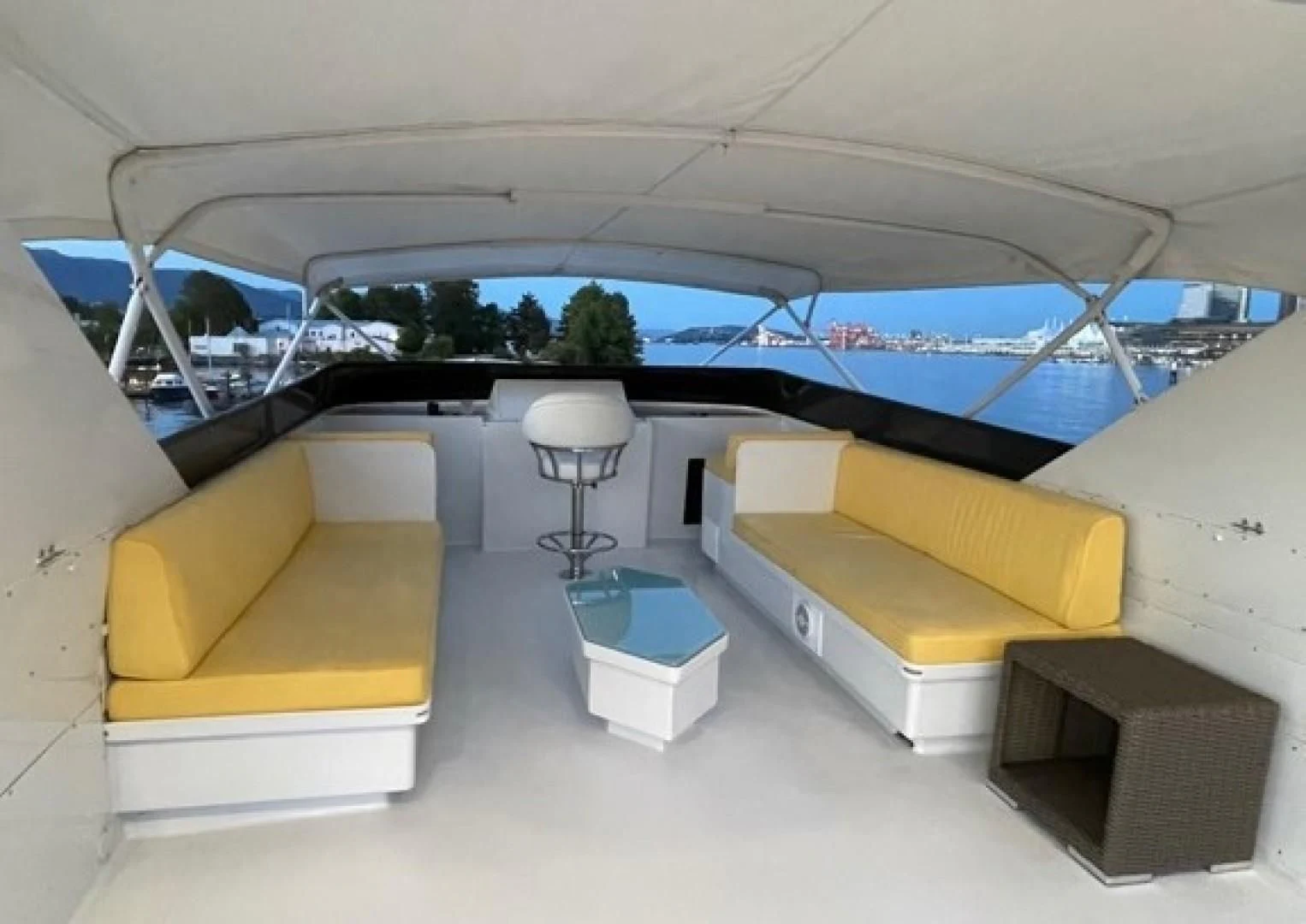a room with a couch and a table and a lamp aboard SOVEREIGN LADY Yacht for Sale