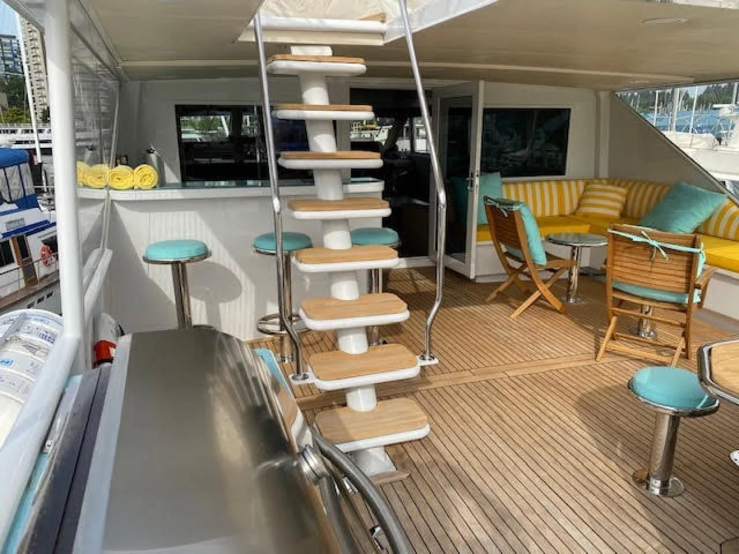 a room with a table and chairs aboard SOVEREIGN LADY Yacht for Sale