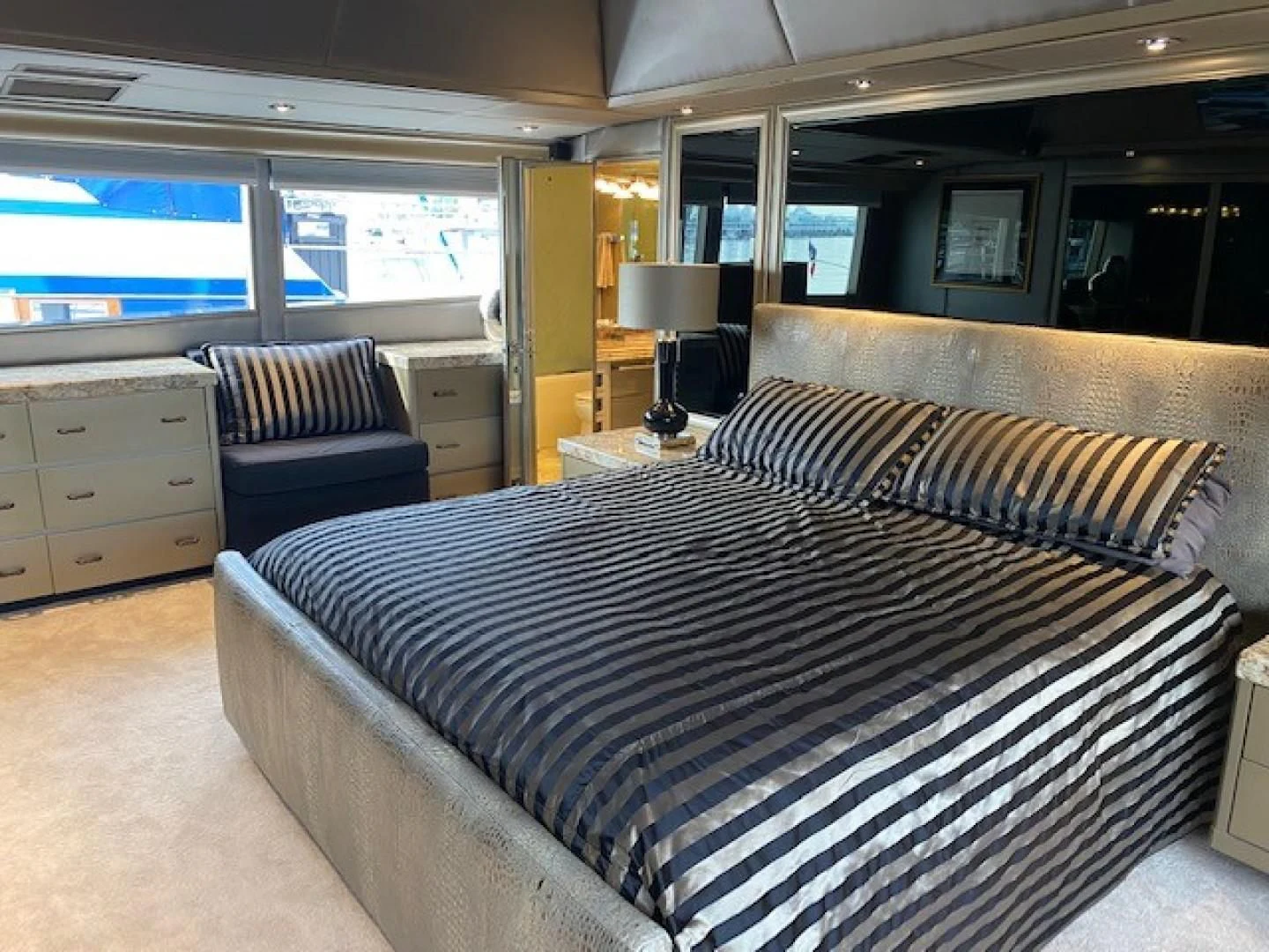 a large bed in a room aboard SOVEREIGN LADY Yacht for Sale