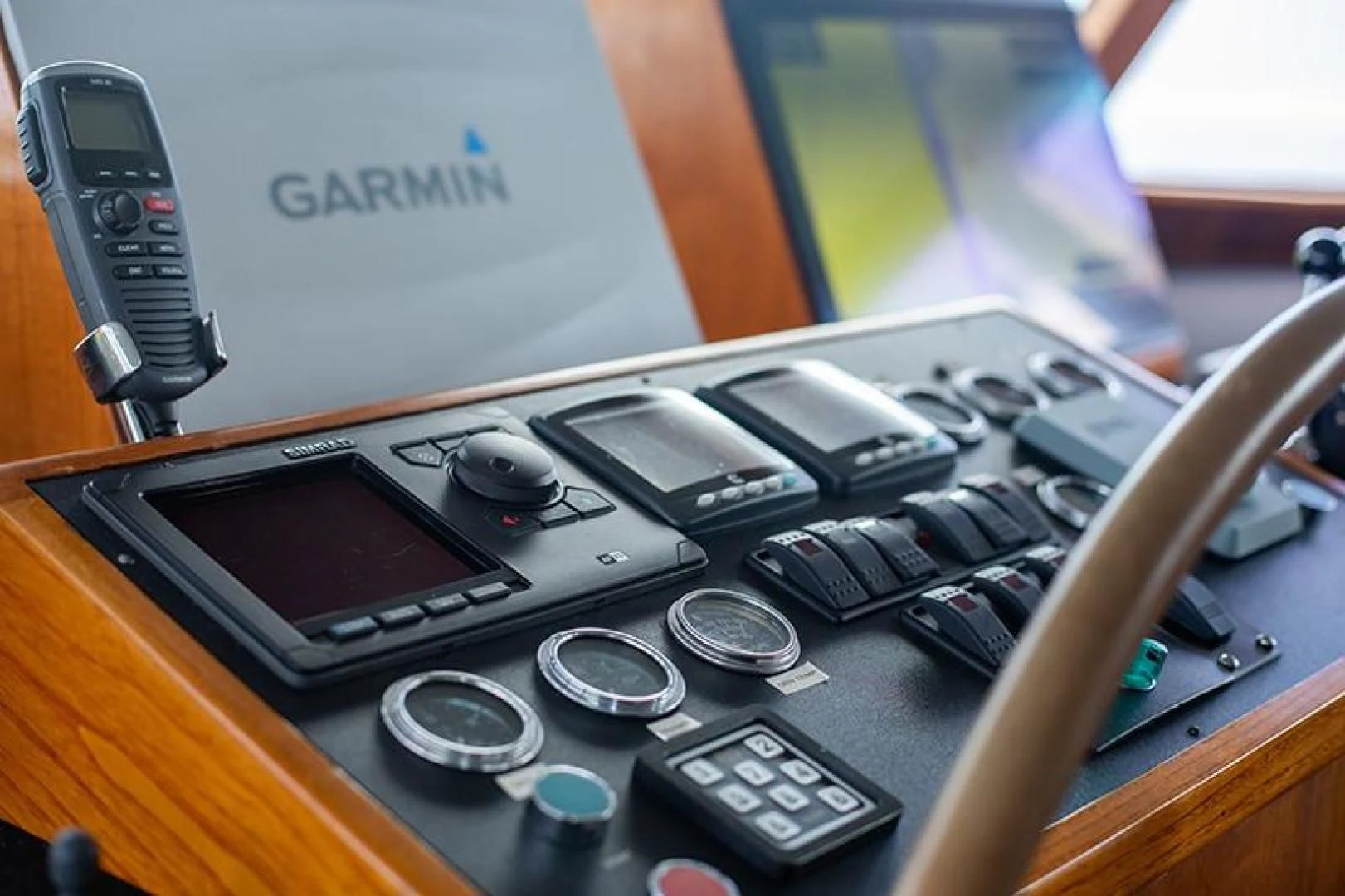 a group of cell phones on a desk aboard SOVEREIGN Yacht for Charter