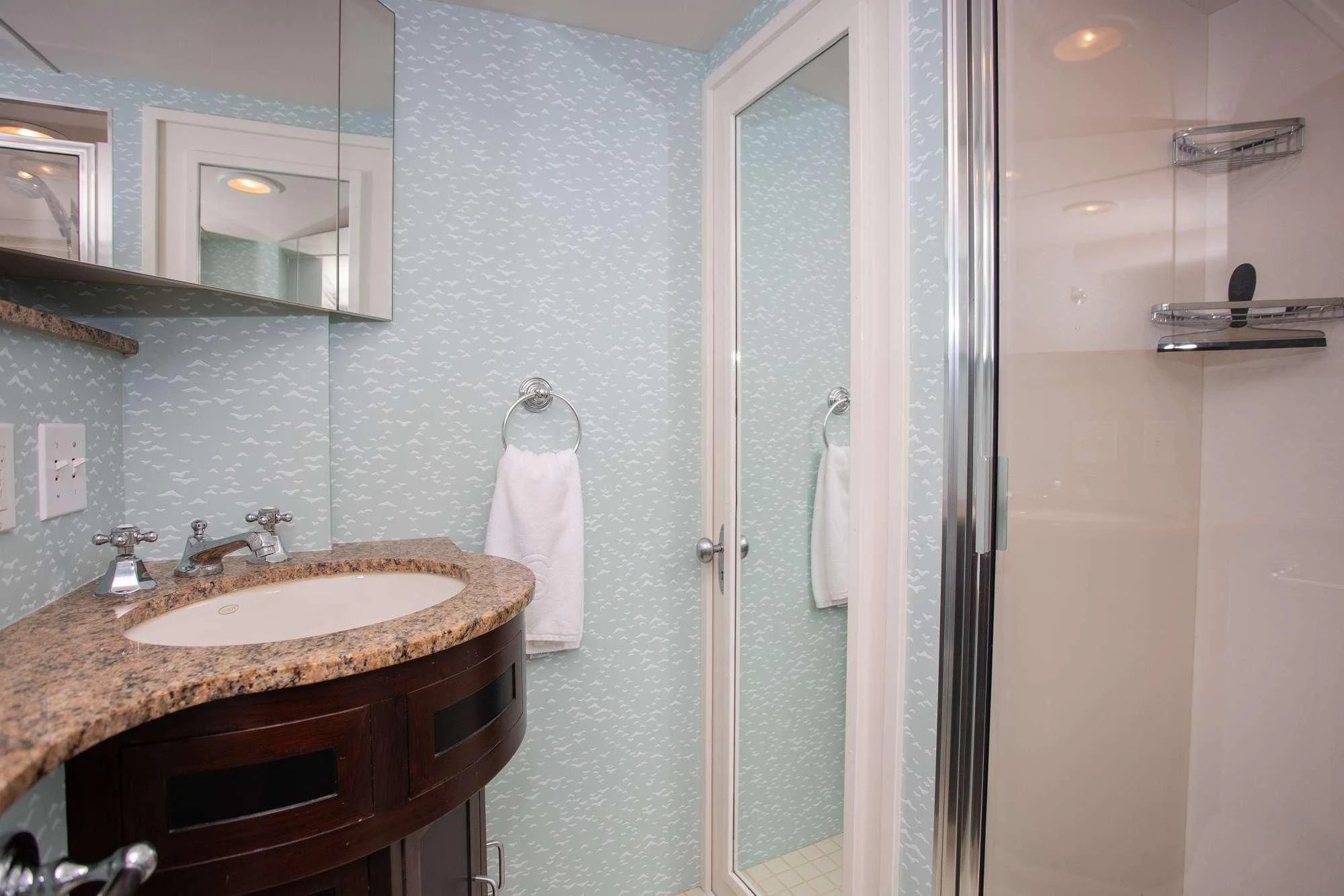 a bathroom with a sink and mirror aboard SOVEREIGN Yacht for Charter