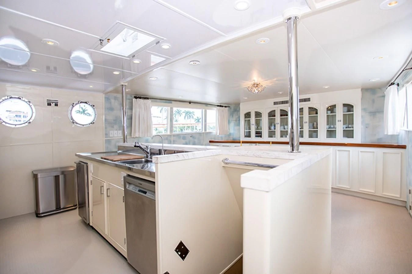 a kitchen with white cabinets aboard SOVEREIGN Yacht for Charter