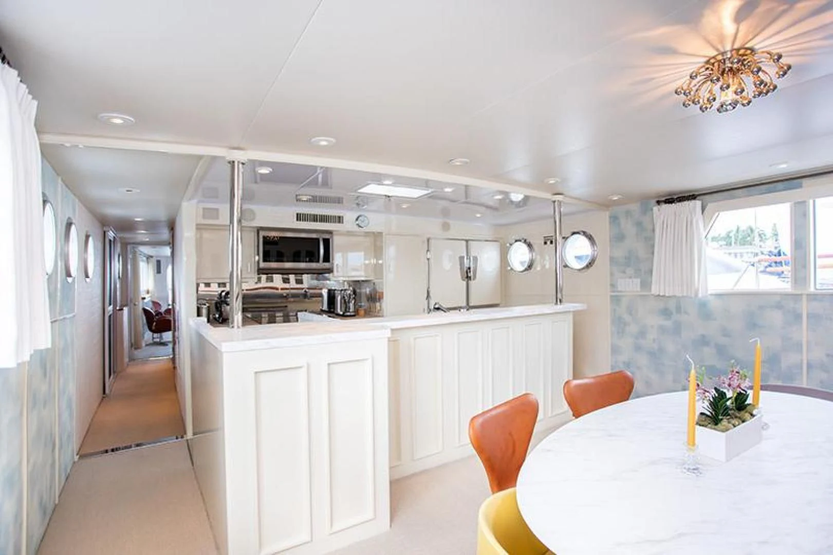 a kitchen with white cabinets aboard SOVEREIGN Yacht for Charter