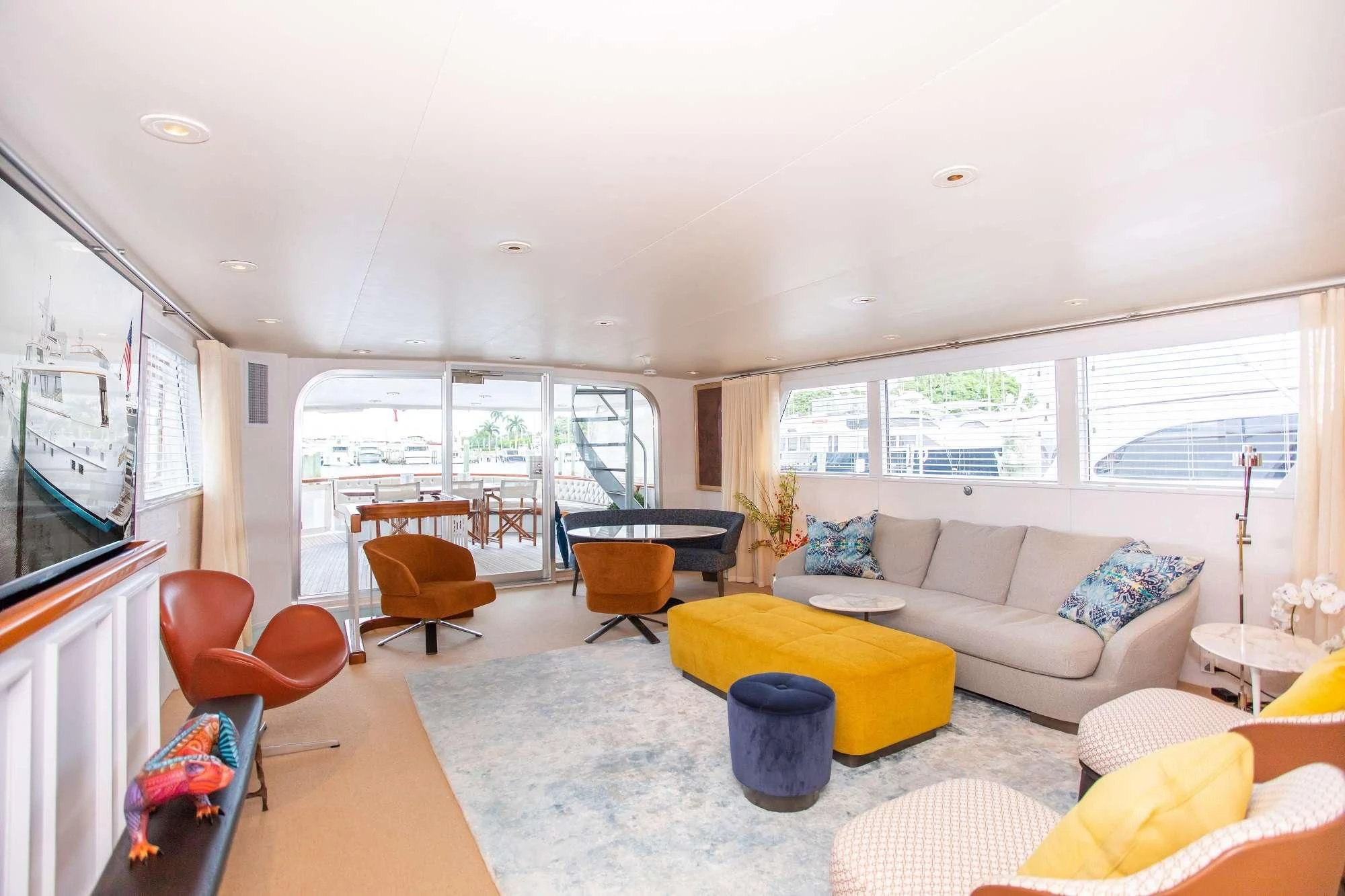 a living room with a couch and a table aboard SOVEREIGN Yacht for Charter